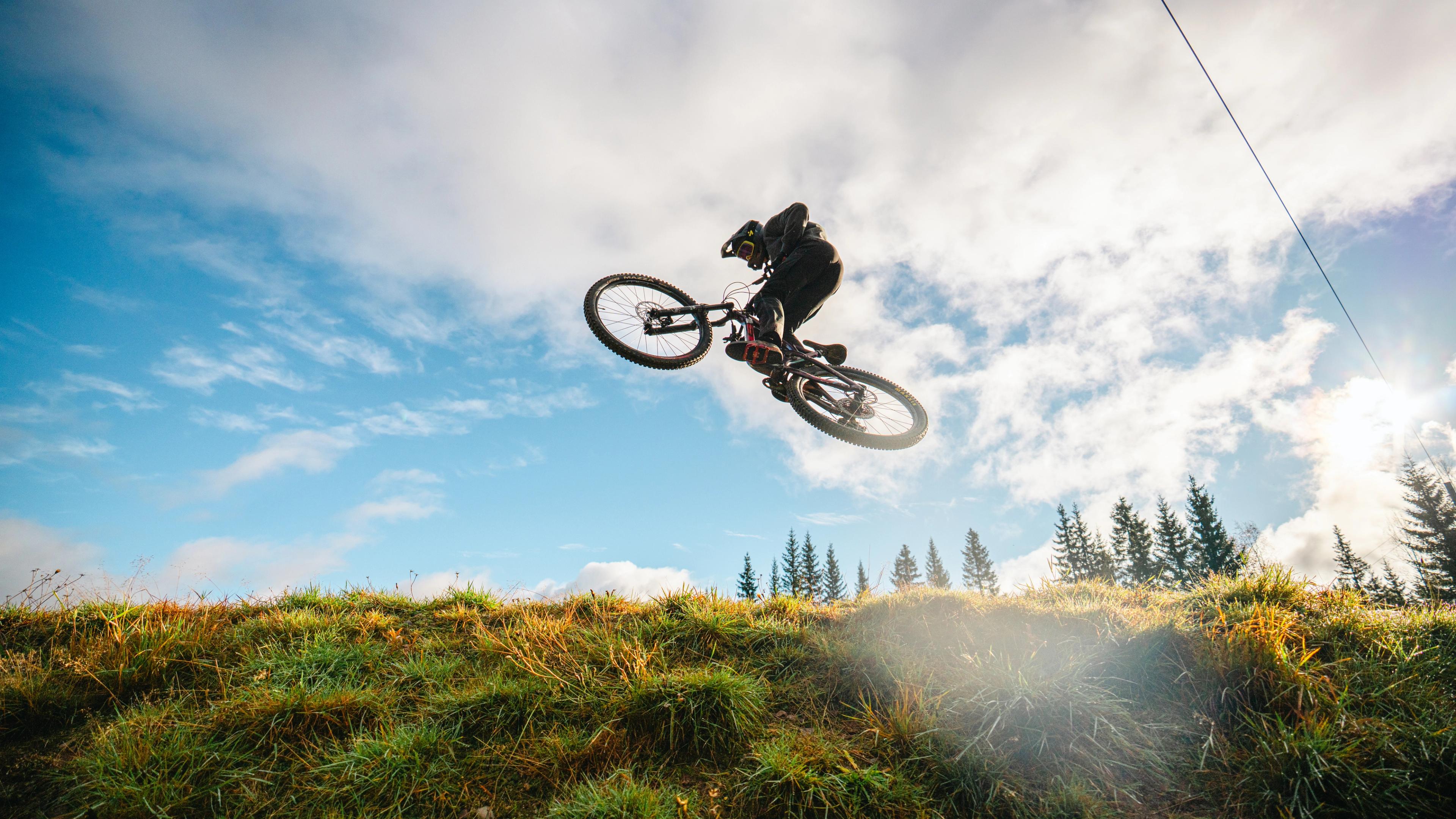 A boy on a bike in mid-air.
