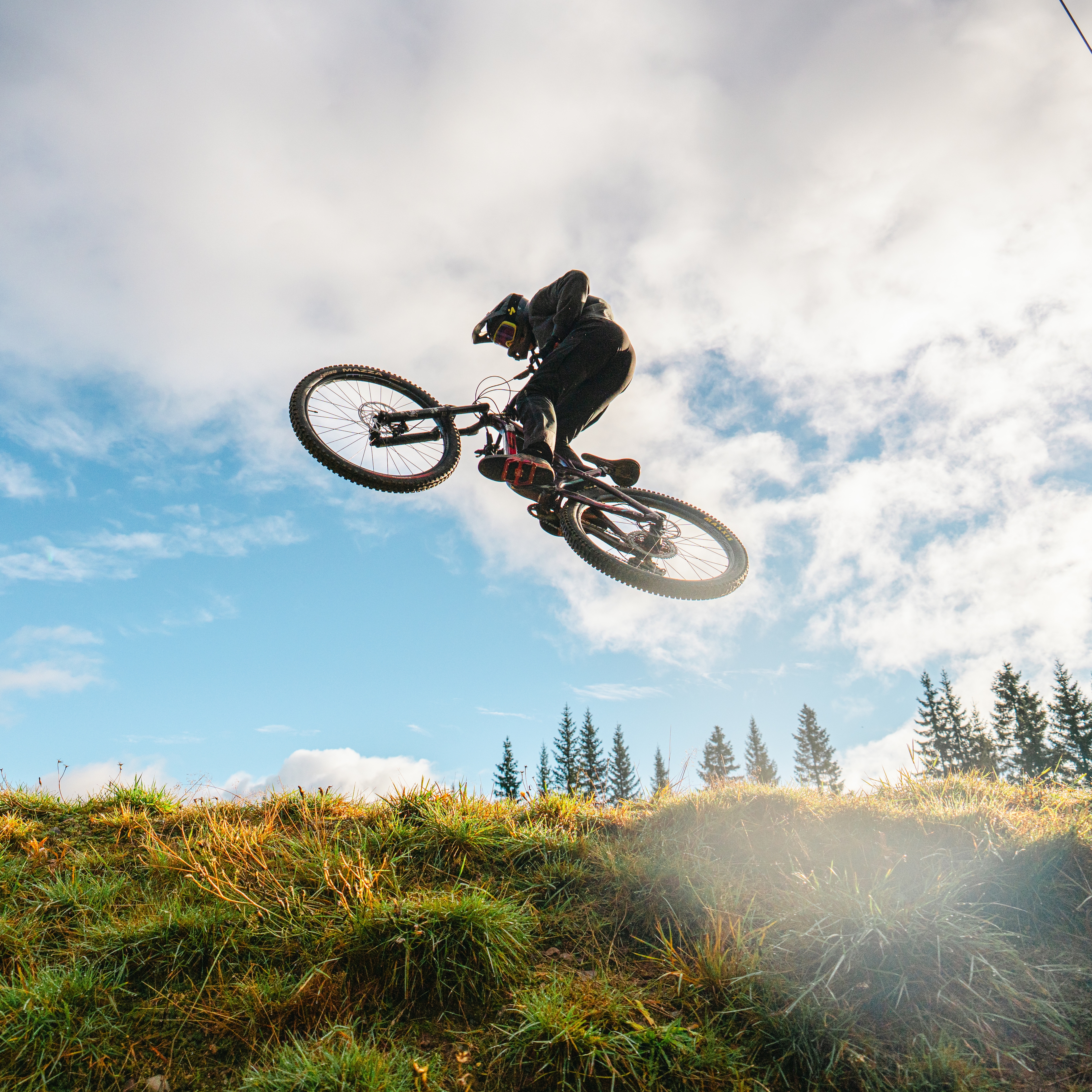 A boy on a bike in mid-air.