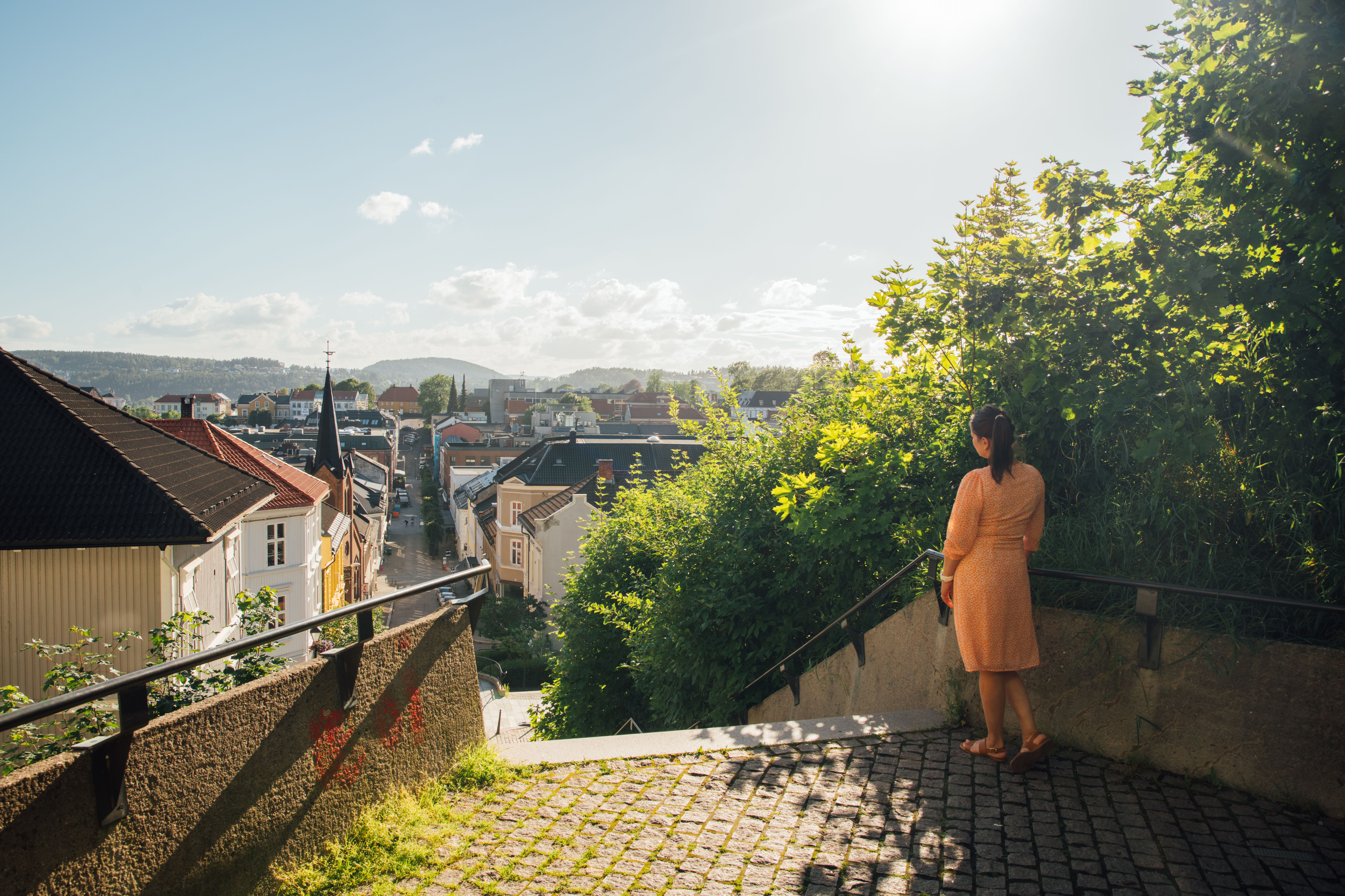 Woman standing by the Ibsentrappa, The Ibsen stairs in Henrik Ibsens hometown Skien in Eastern Norway