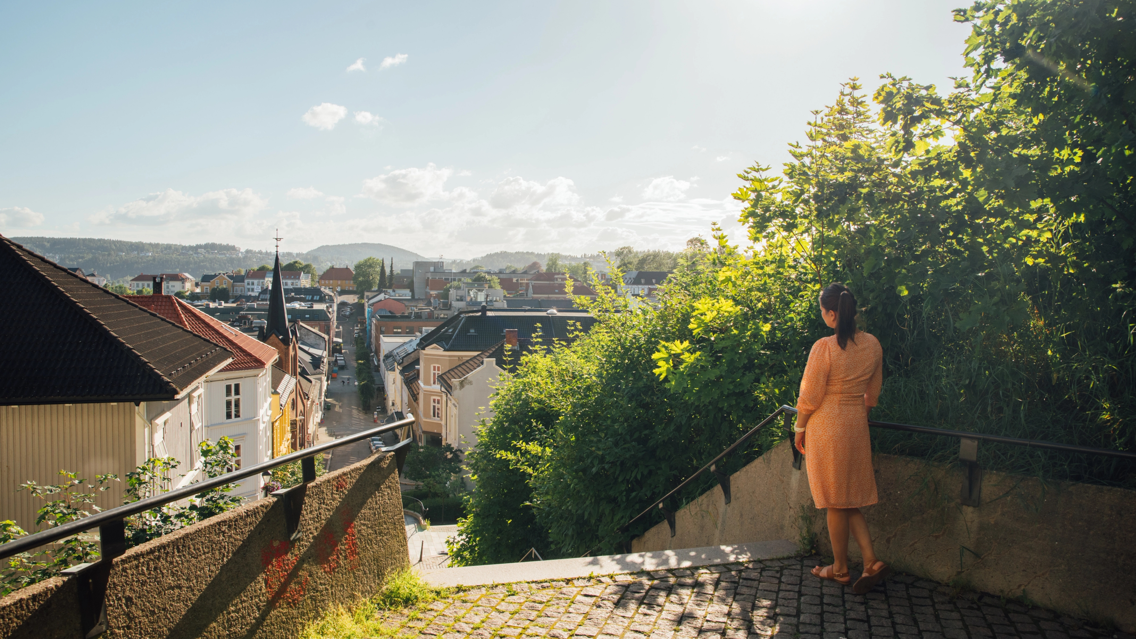 Woman standing by the Ibsentrappa, The Ibsen stairs in Henrik Ibsens hometown Skien in Eastern Norway