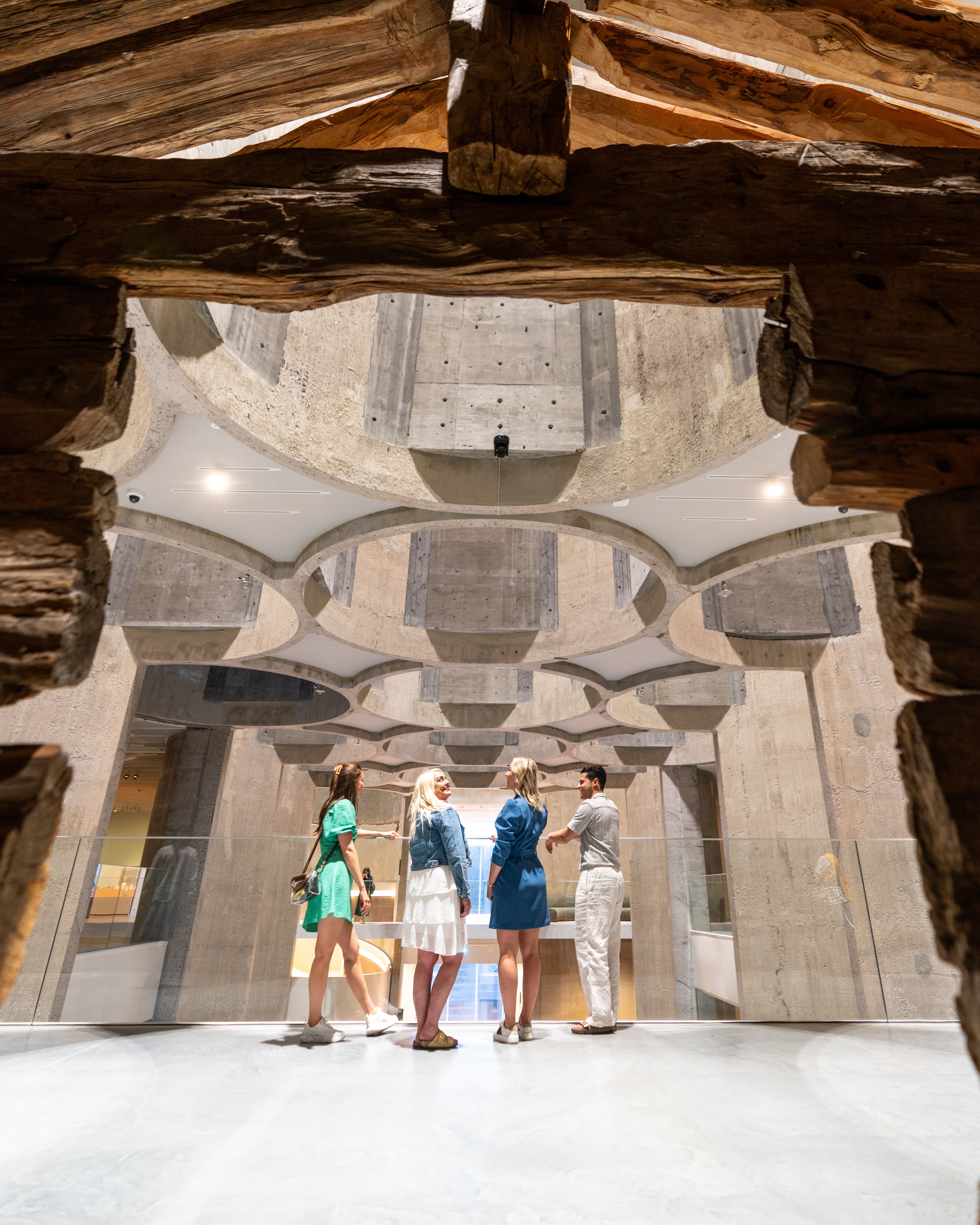 Four people inside the Kunstsilo art museum in Kristiansand