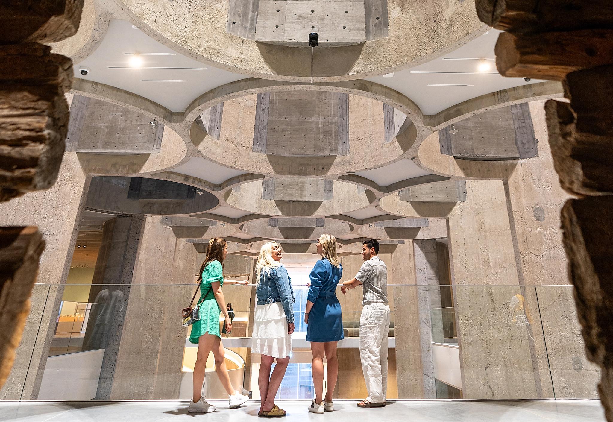 Four people inside the Kunstsilo art museum in Kristiansand