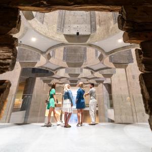 Four people inside the Kunstsilo art museum in Kristiansand