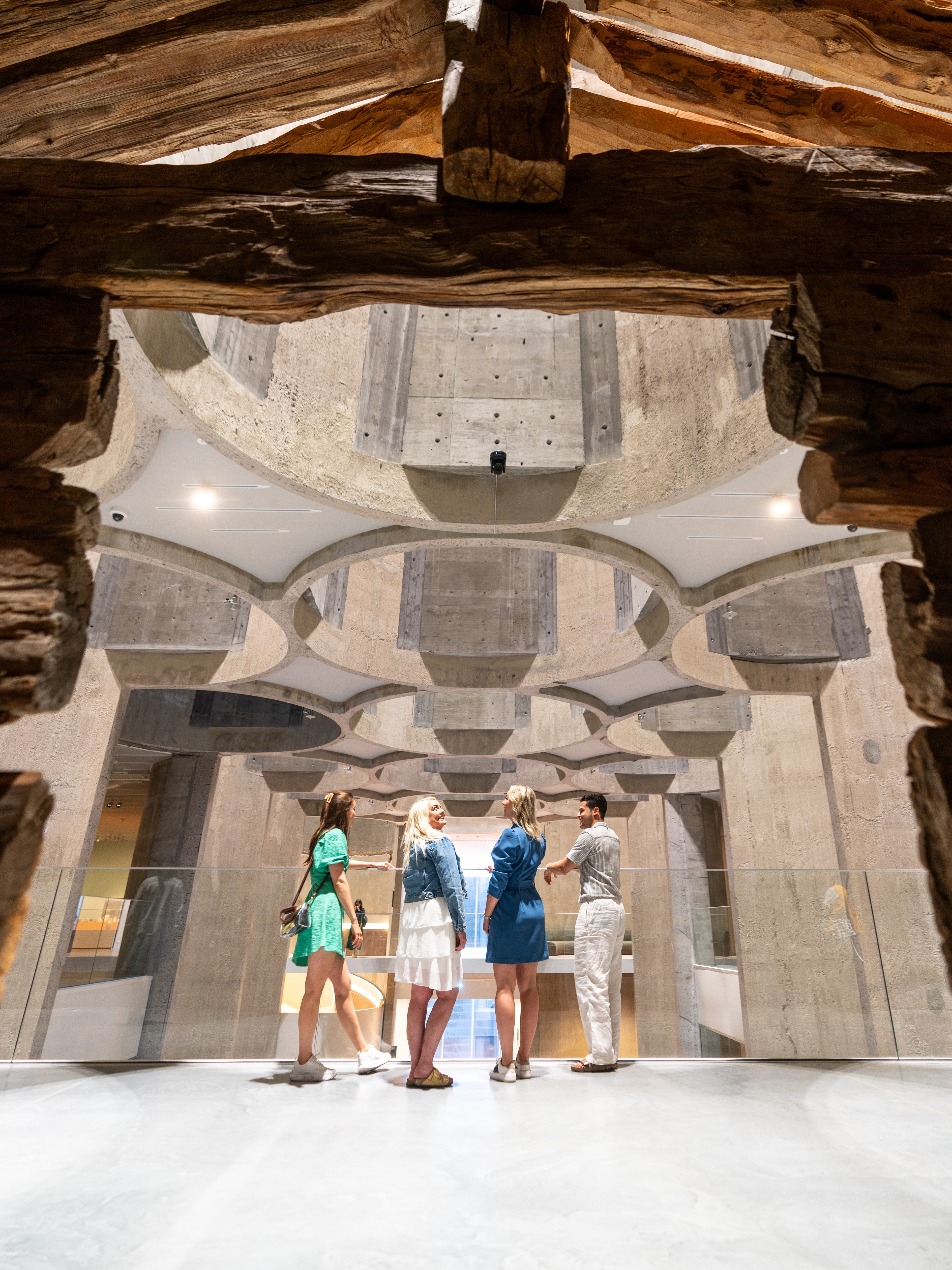 Four people inside the Kunstsilo art museum in Kristiansand