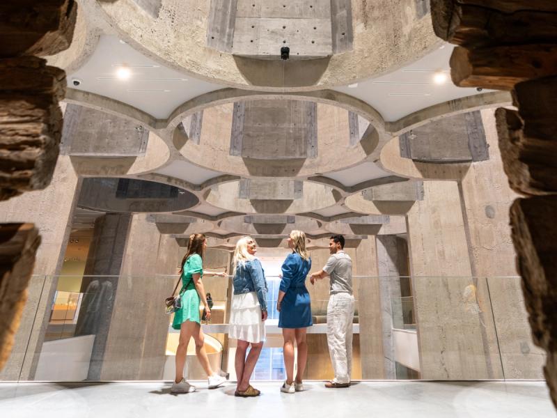 Four people inside the Kunstsilo art museum in Kristiansand