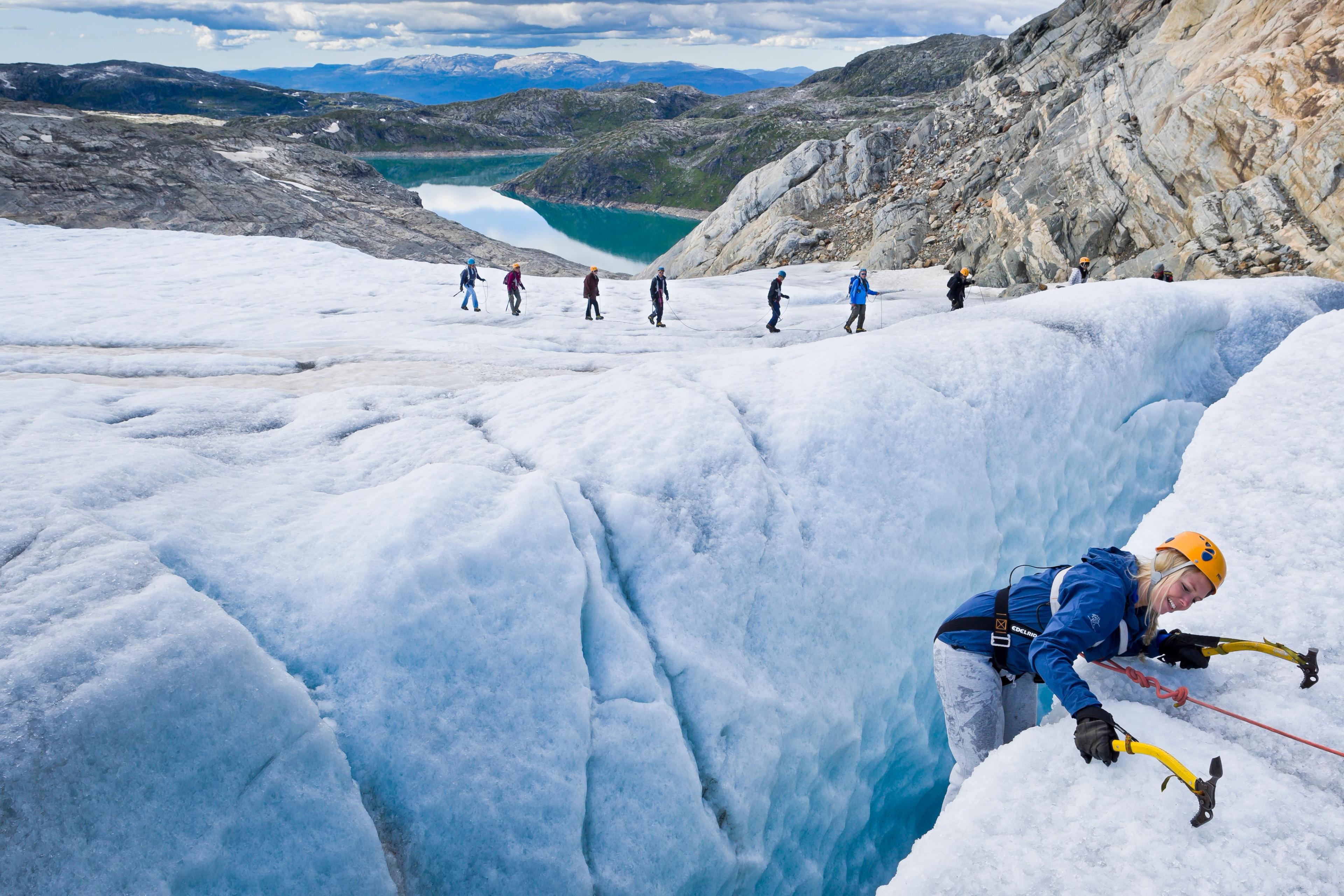 People on a guided hike on the Folgefonna glacier in the Hardangerfjord region, Fjord Norway