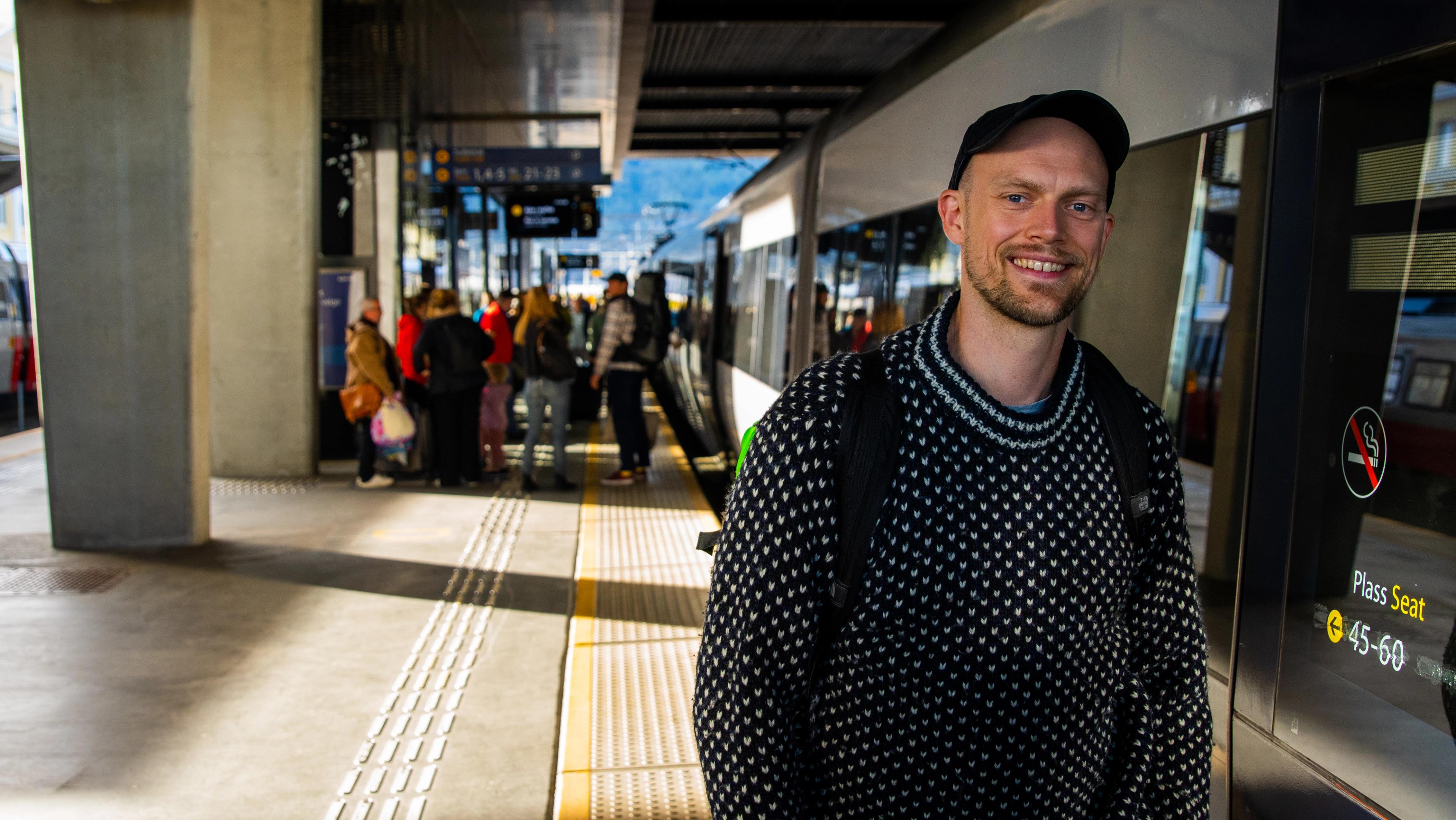 A man standing at a train station