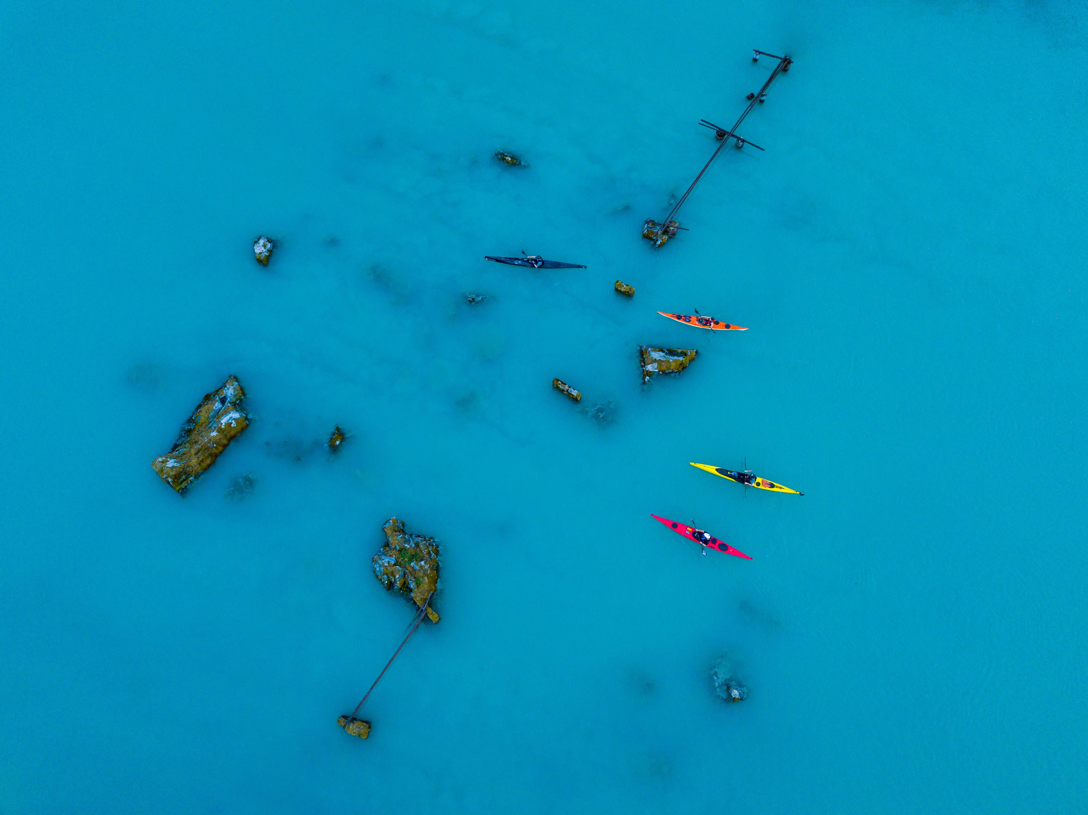 Birds eye view of people kayaking on a lake