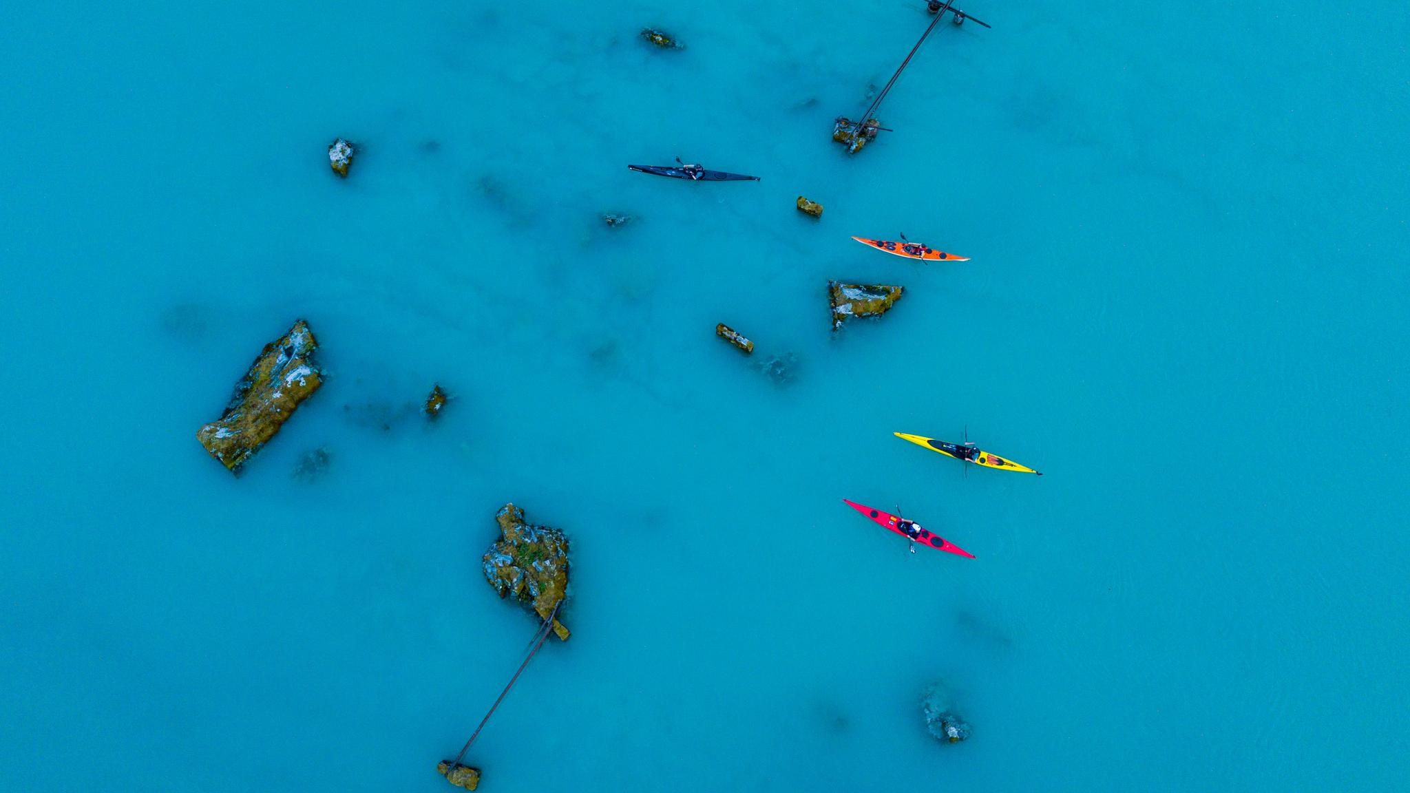 Birds eye view of people kayaking on a lake