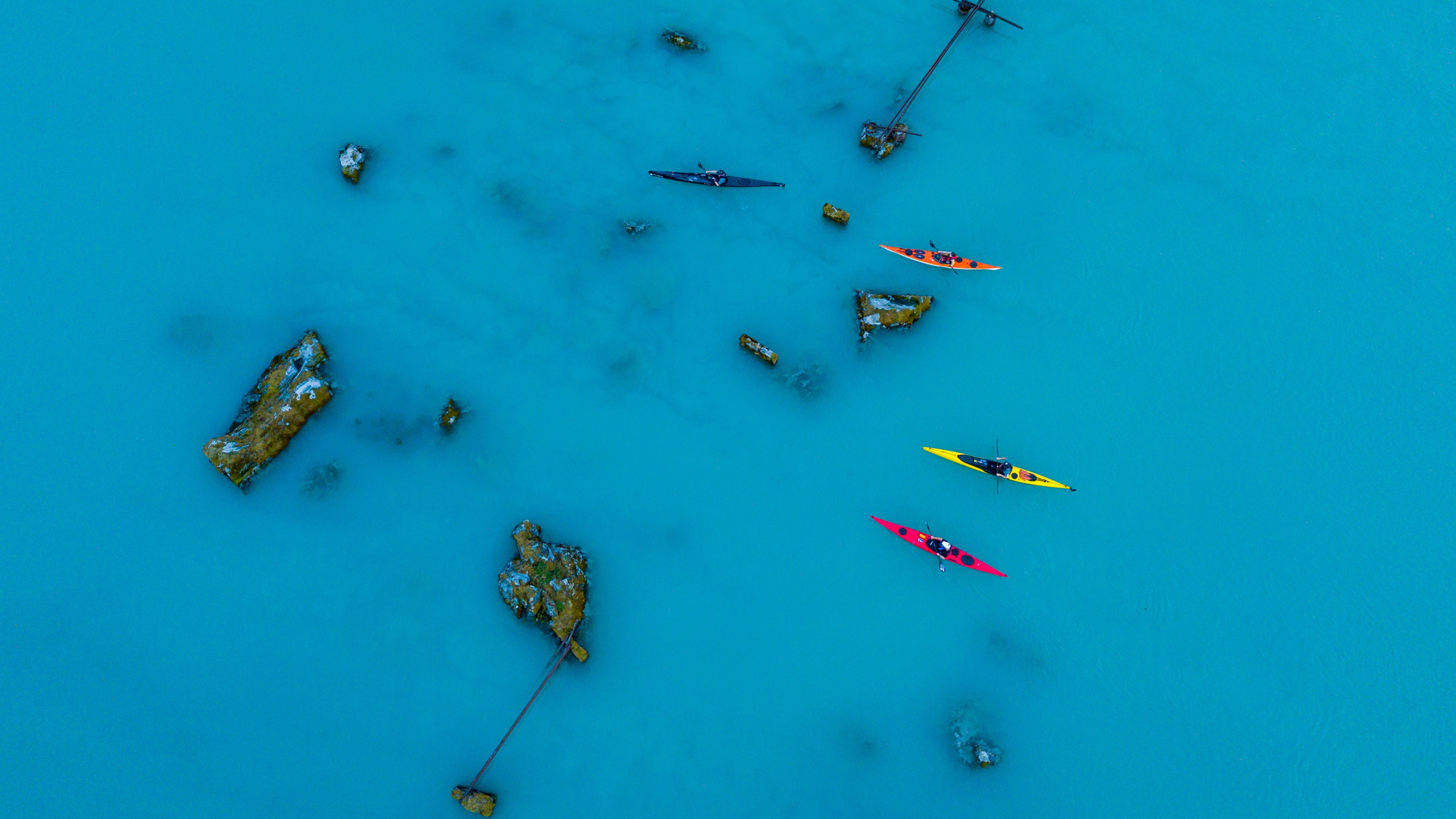 Birds eye view of people kayaking on a lake