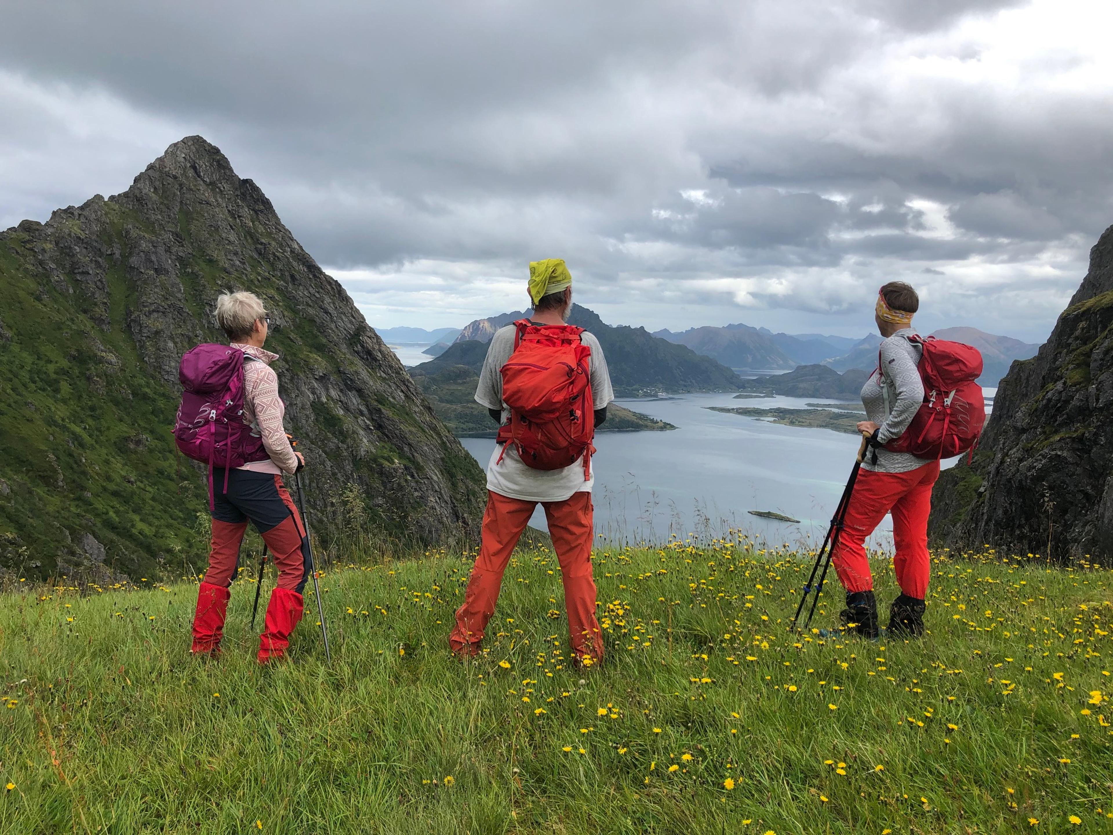 Three people watching the view from Dronningruta (The Queens route) in Bø, Kremmardalskaret, Northern Norway