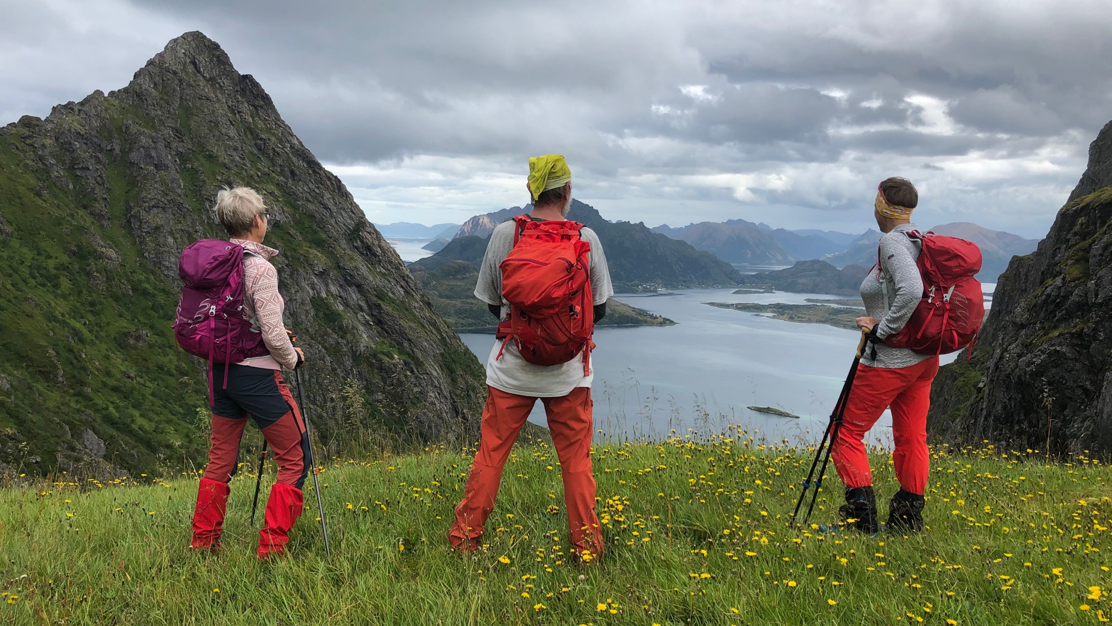 Three people watching the view from Dronningruta (The Queens route) in Bø, Kremmardalskaret, Northern Norway