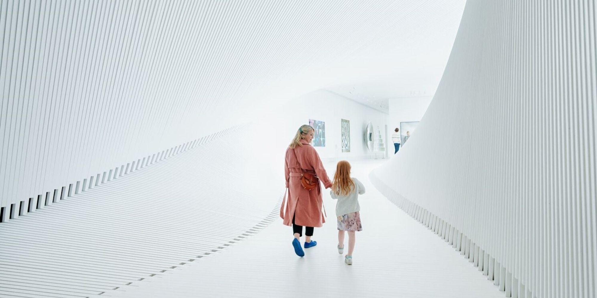 Mother and child walking inside The Twist at Kistefos, Hadeland