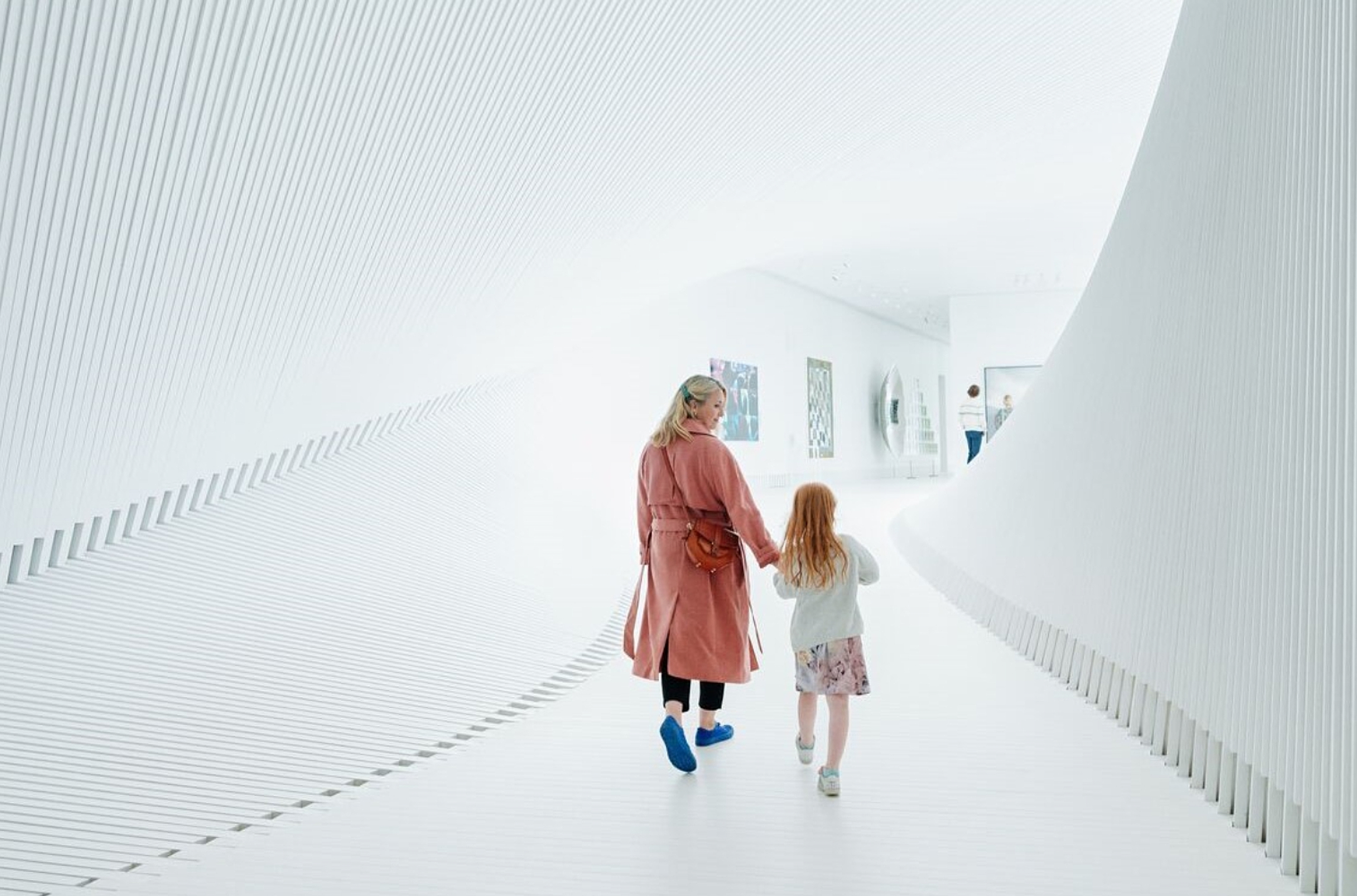 Mother and child walking inside The Twist at Kistefos, Hadeland