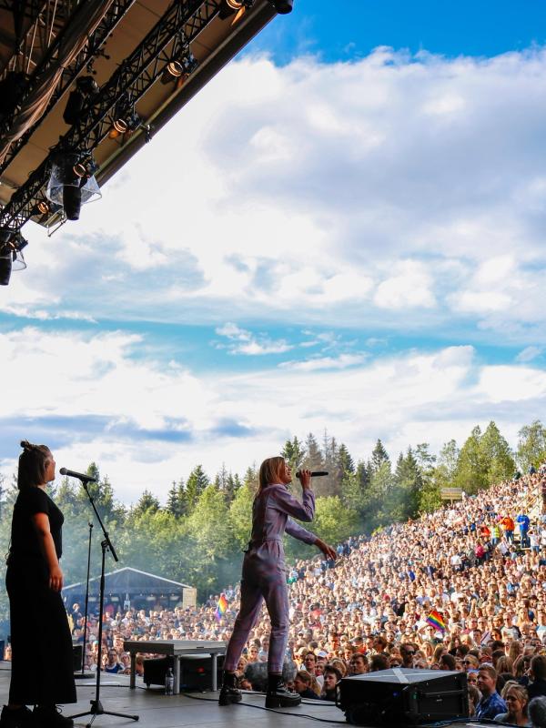 A musican performing in front of a large crowd at OsloOslo music festival at Grefsenkollen in Oslo, Eastern Norway