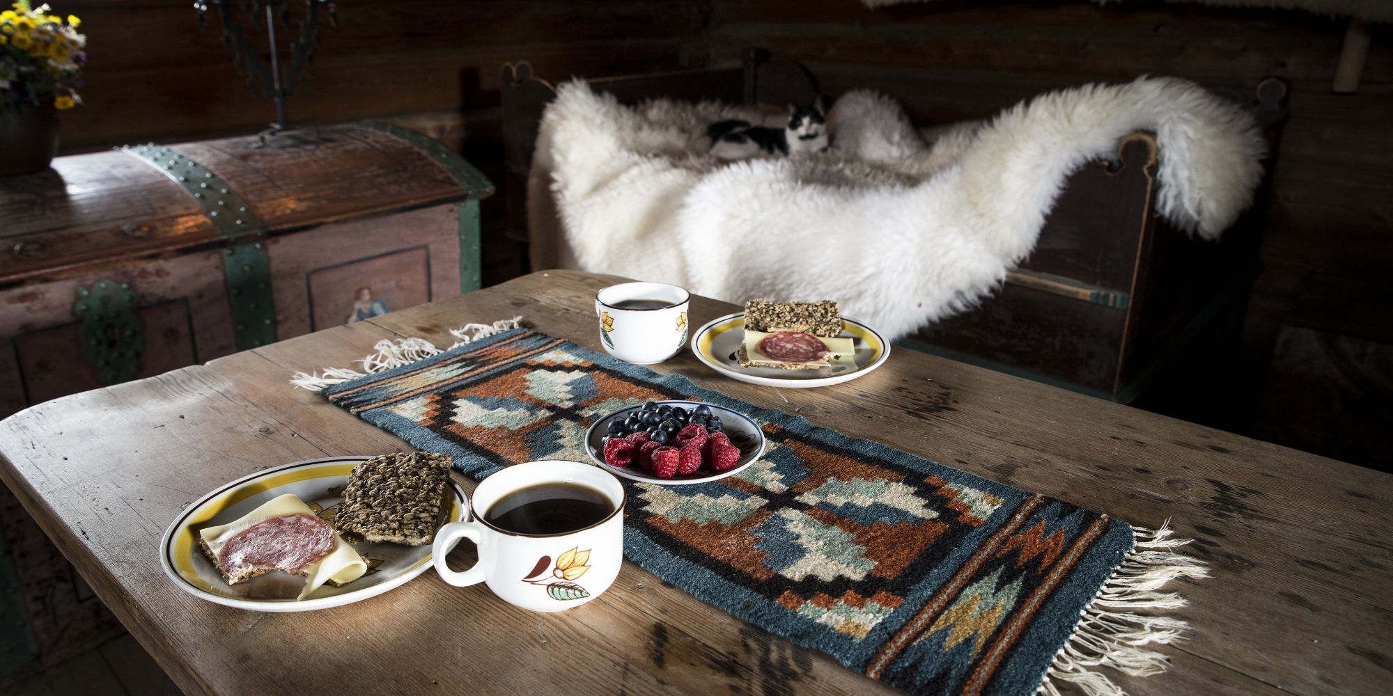 Food on an old wooden table at Sygard Grytting