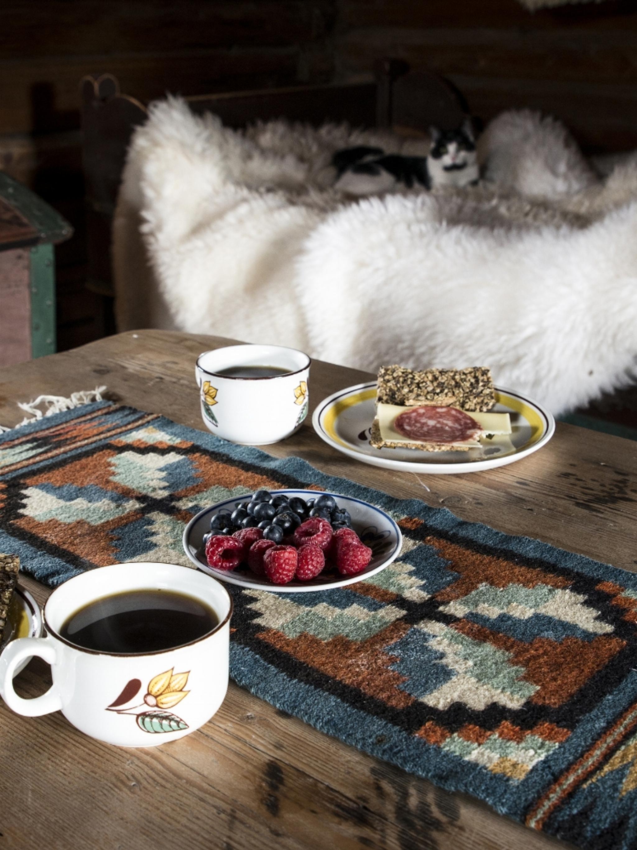 Food on an old wooden table at Sygard Grytting