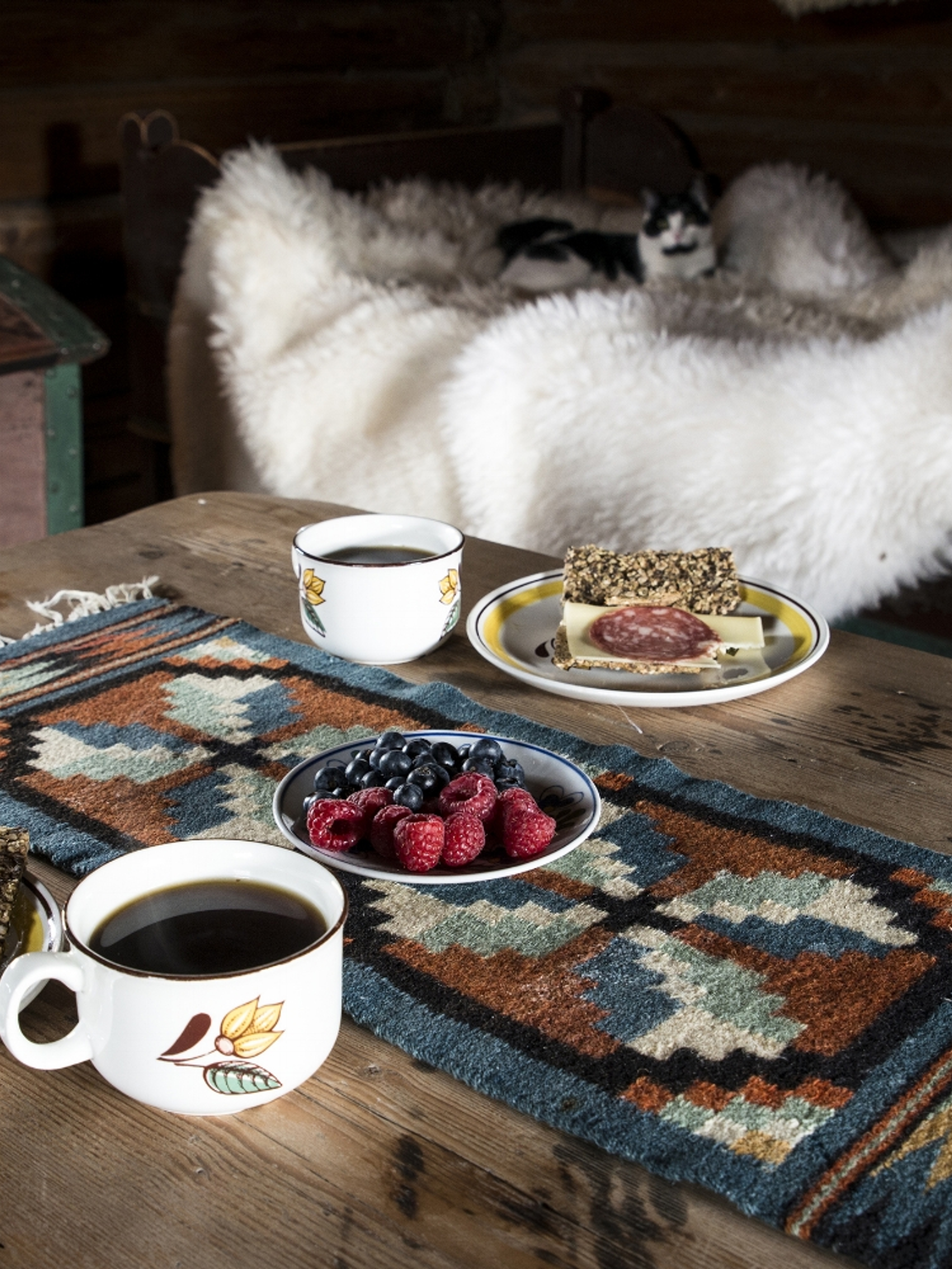 Food on an old wooden table at Sygard Grytting