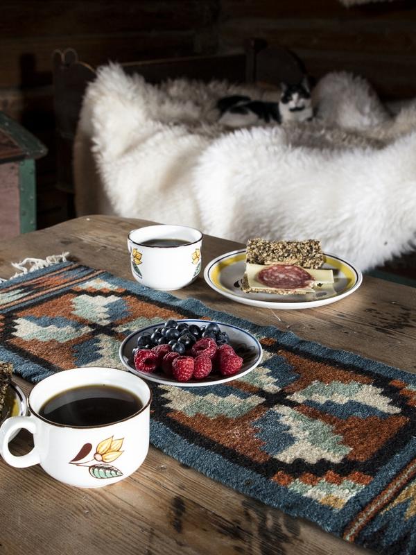 Food on an old wooden table at Sygard Grytting