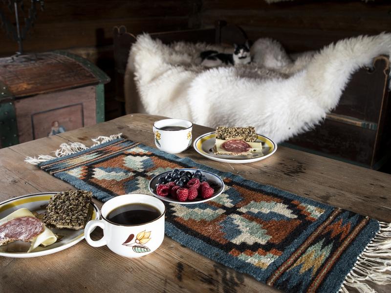 Food on an old wooden table at Sygard Grytting