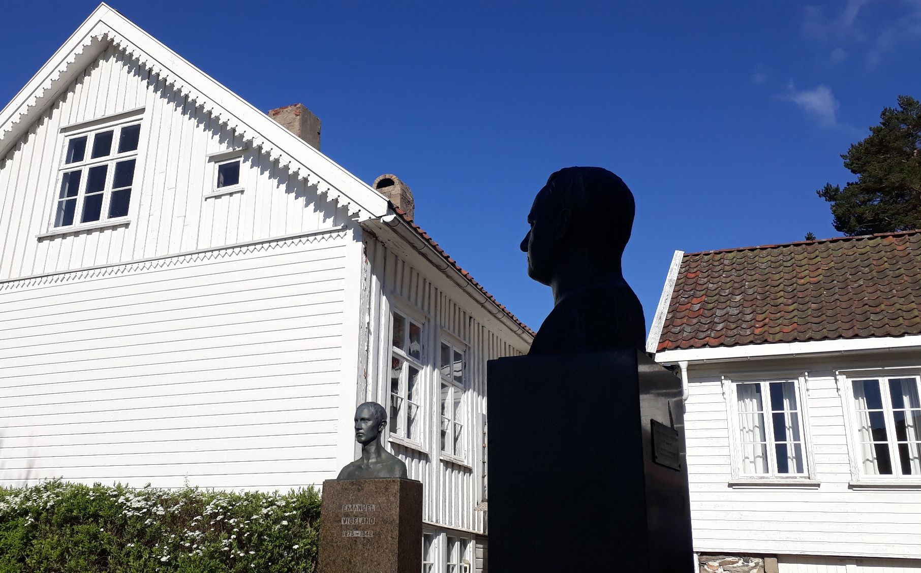 Busts of the artists Gustav and Emanuel Vigeland outside of their childhood home Vigelands hus in Mandal, Southern Norway