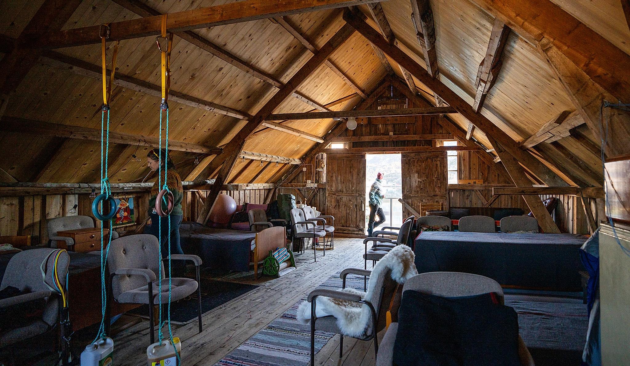A loft at a sea shack with vintage furniture.