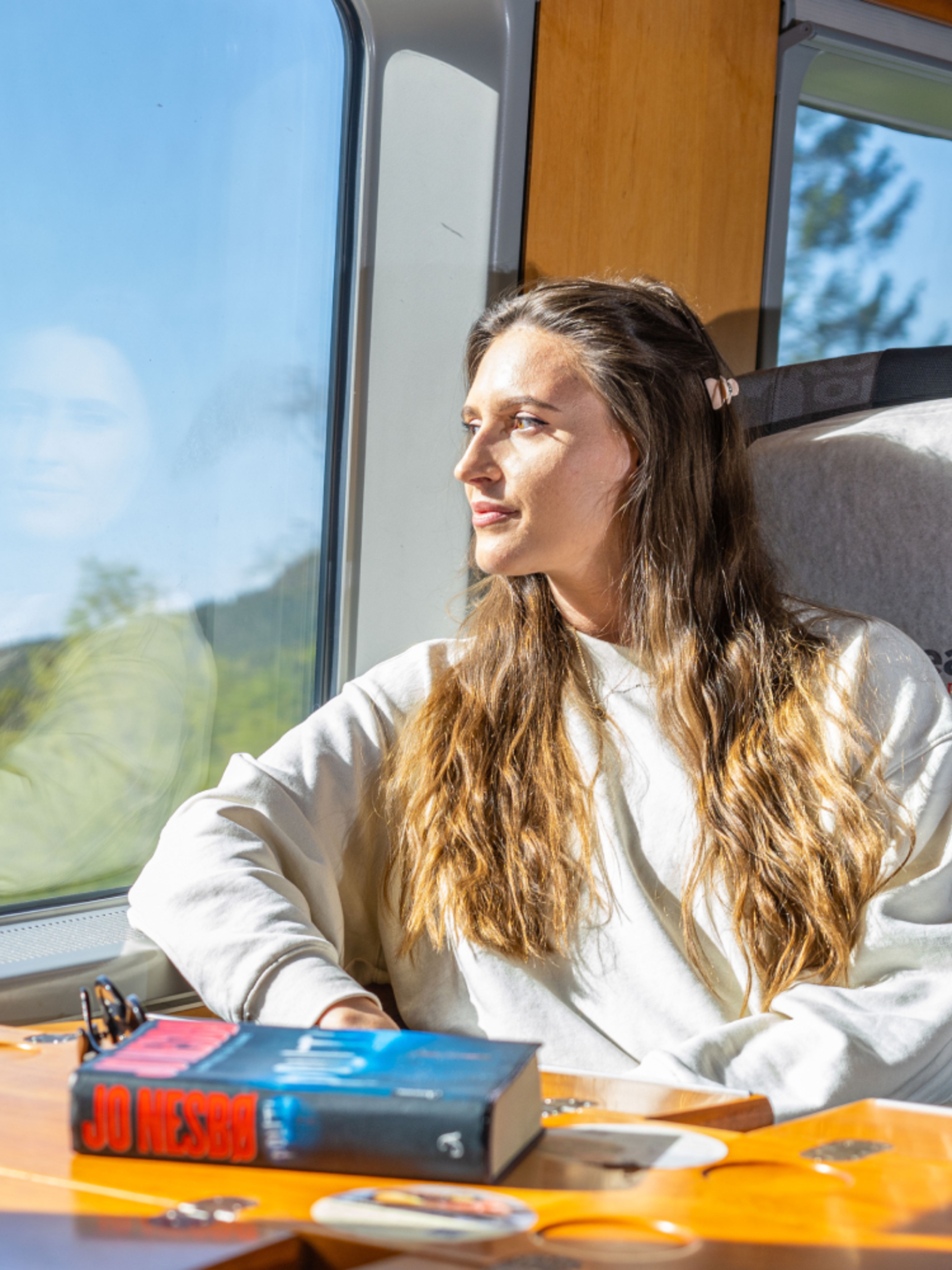 A woman riding the Sørland Line train from Oslo to Stavanger, Norway