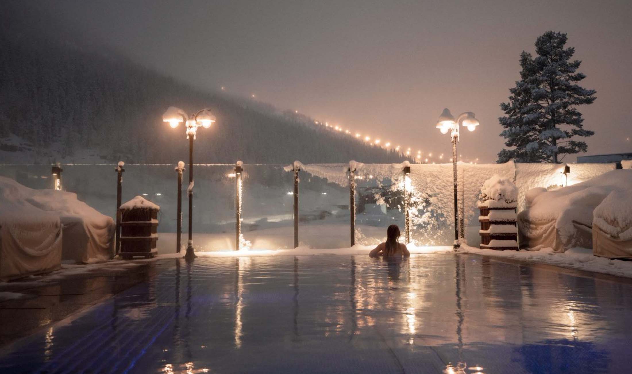 Woman enjoying view from a pool at Fyri resort, Hemsedal