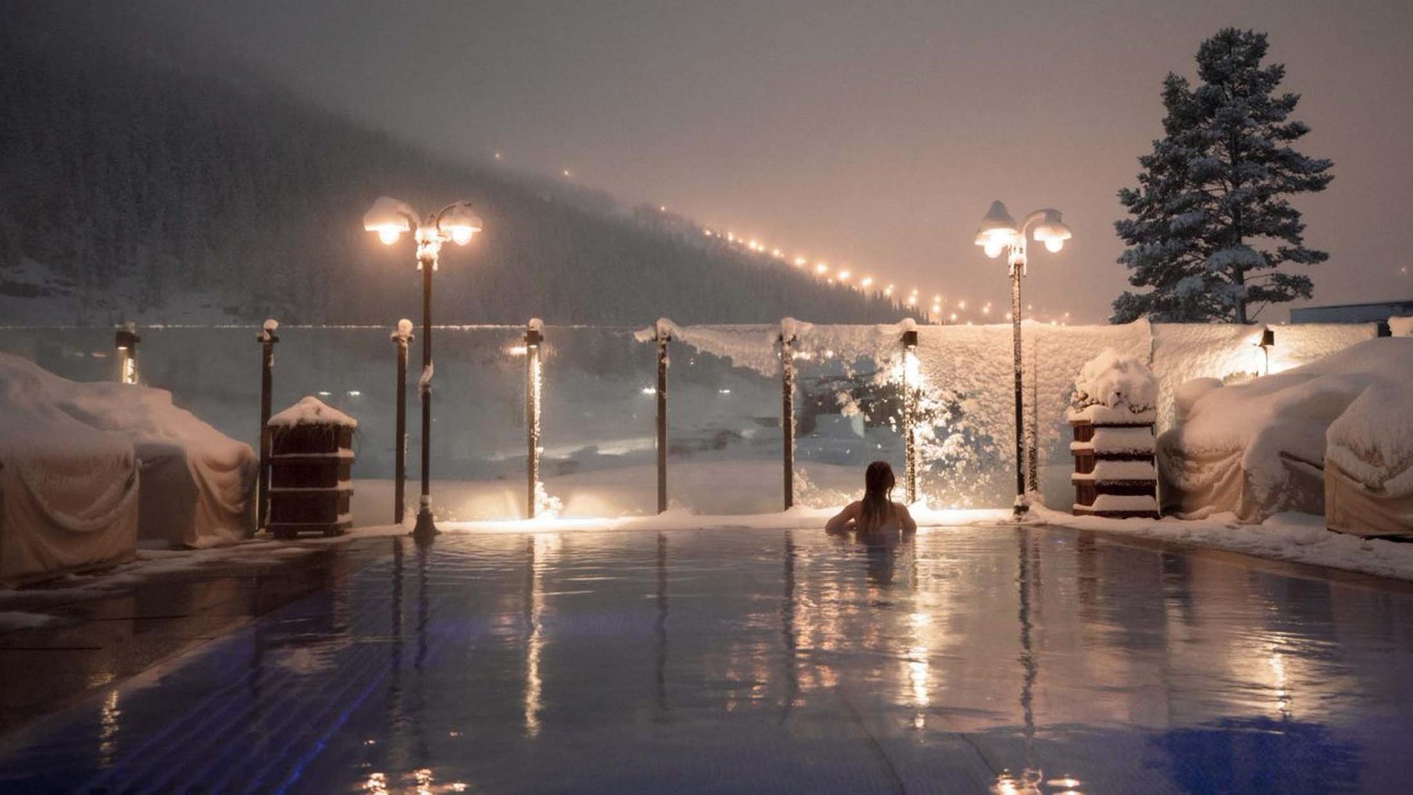 Woman enjoying view from a pool at Fyri resort, Hemsedal