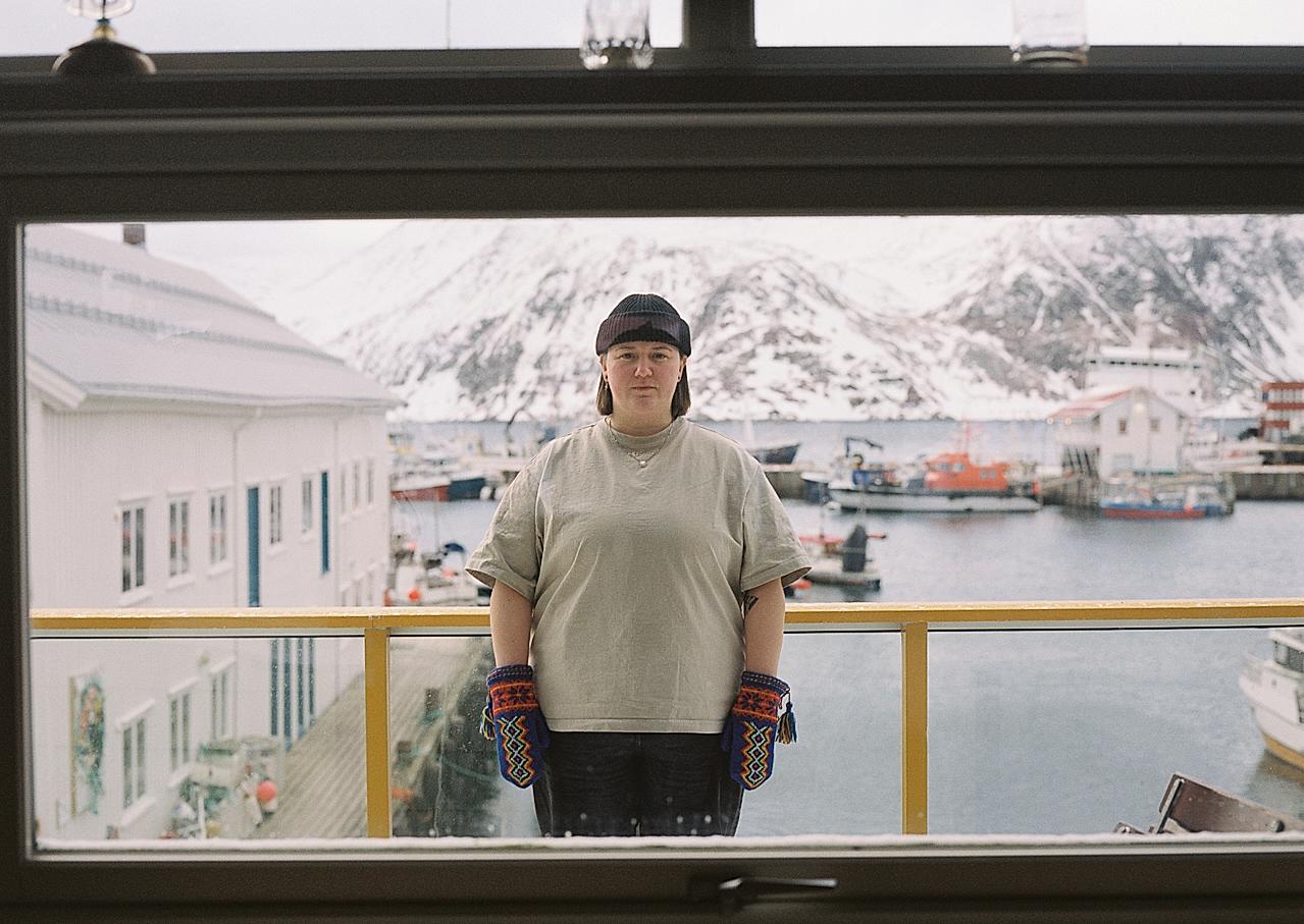 A sami woman in a snow covered harbour