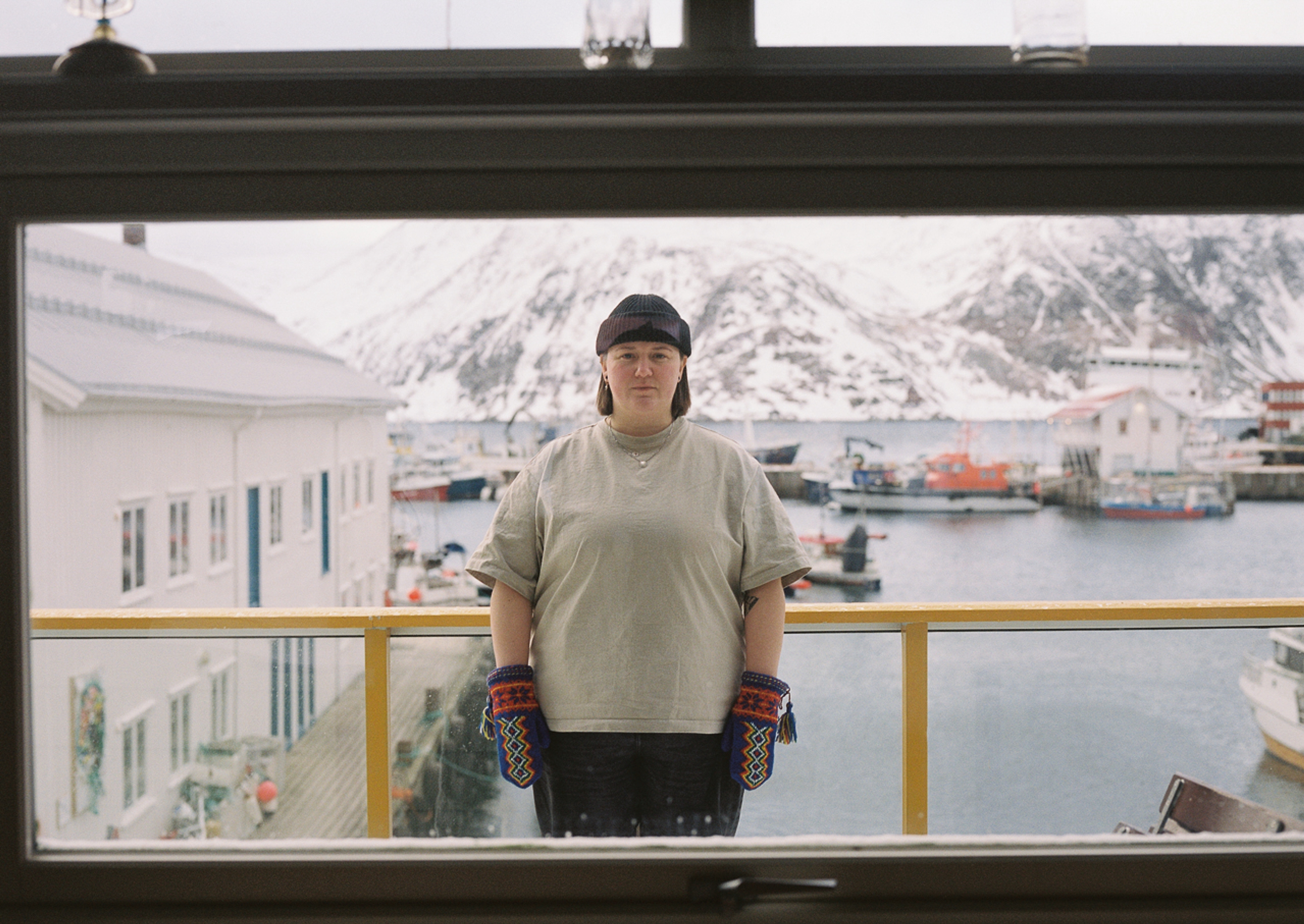 A sami woman in a snow covered harbour