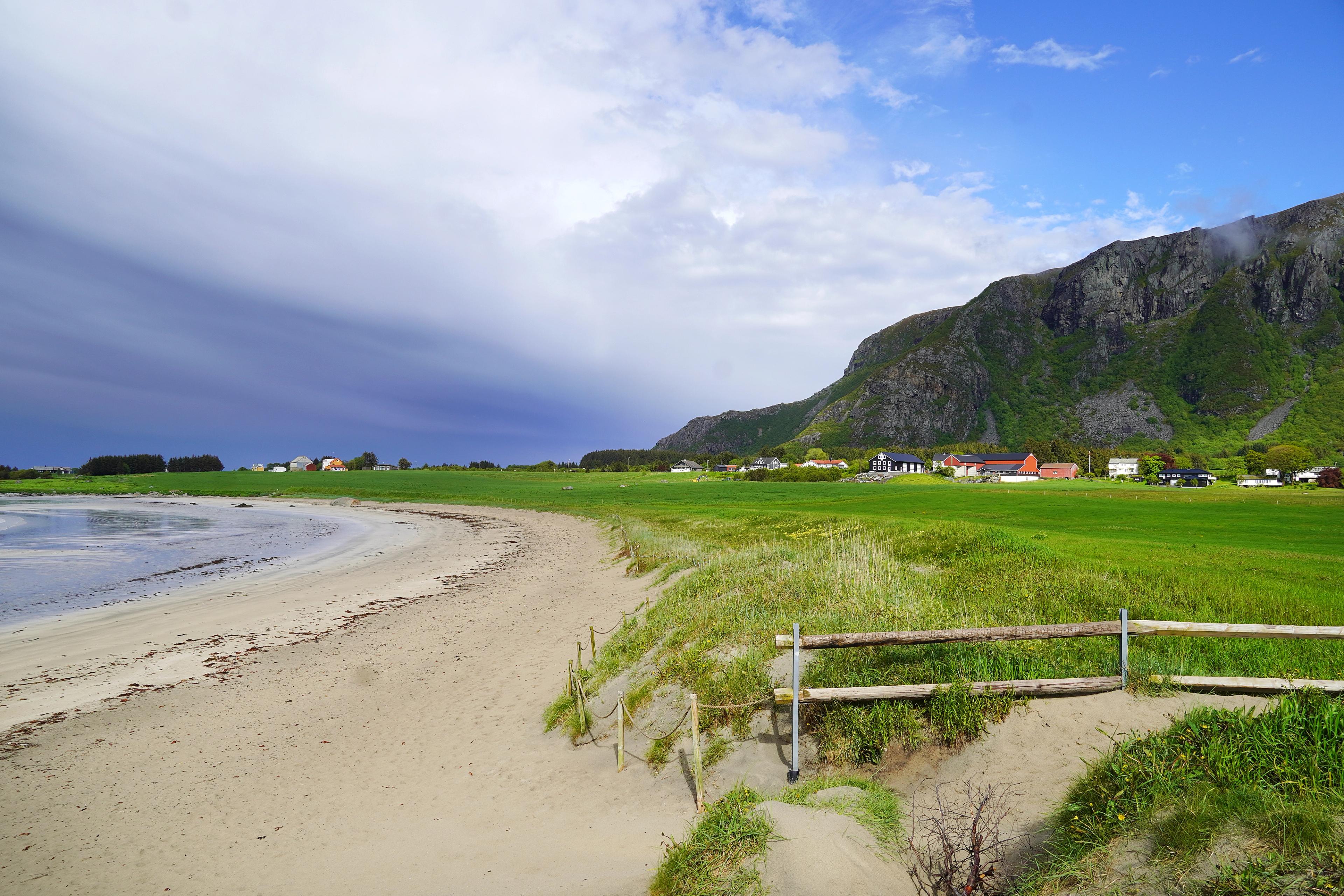 Farstadsanden golden beach and mountains behind.