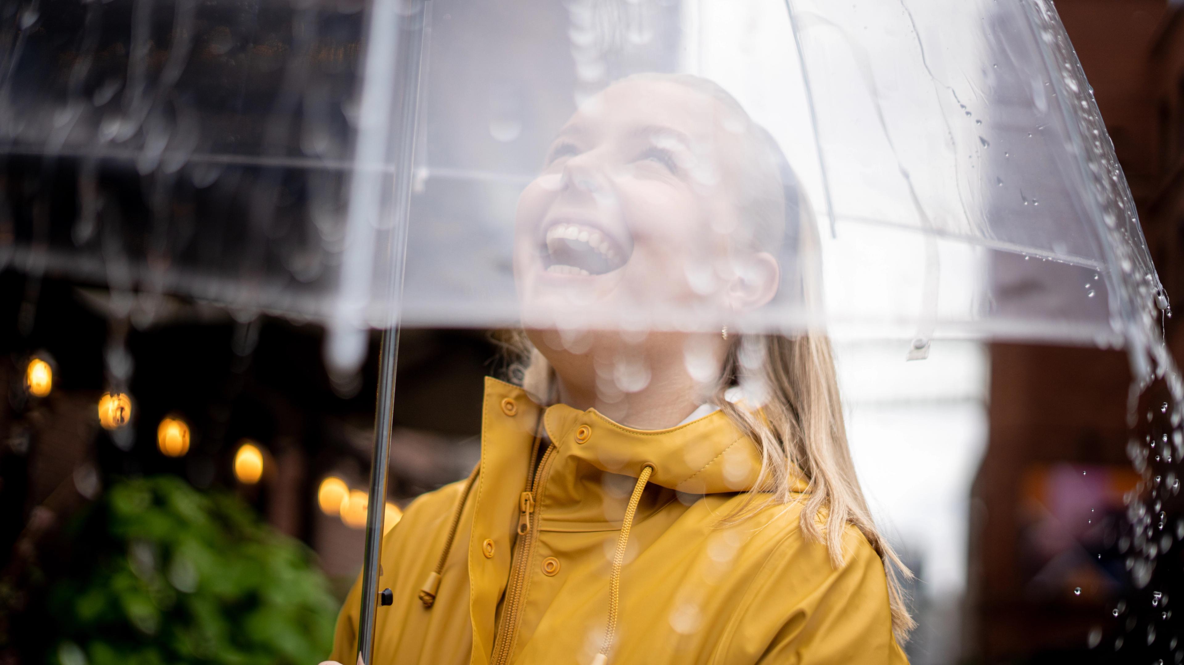 Woman with umbrella on a rainy day in Oslo, Eastern Norway