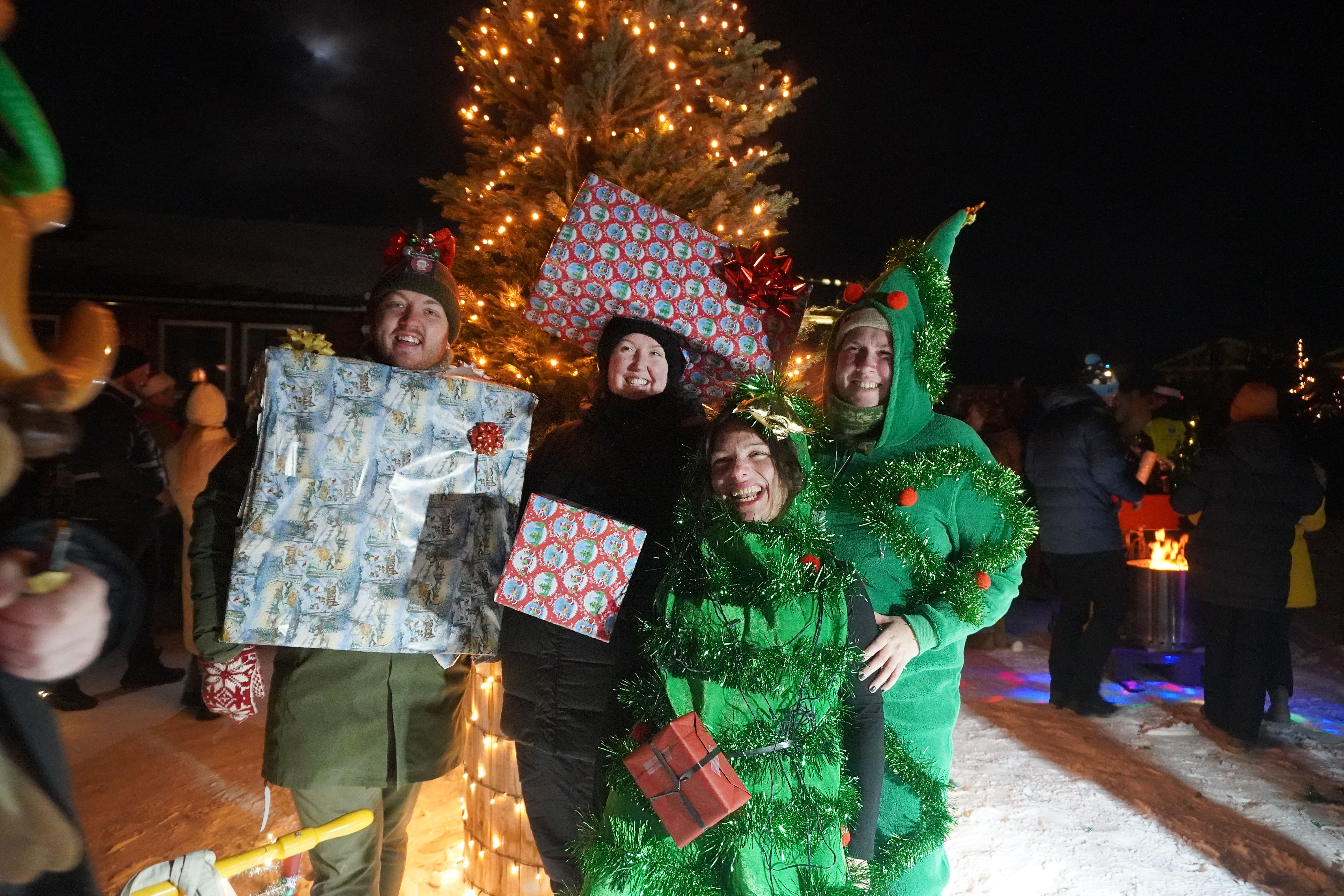 People dressed in Christmas outfits