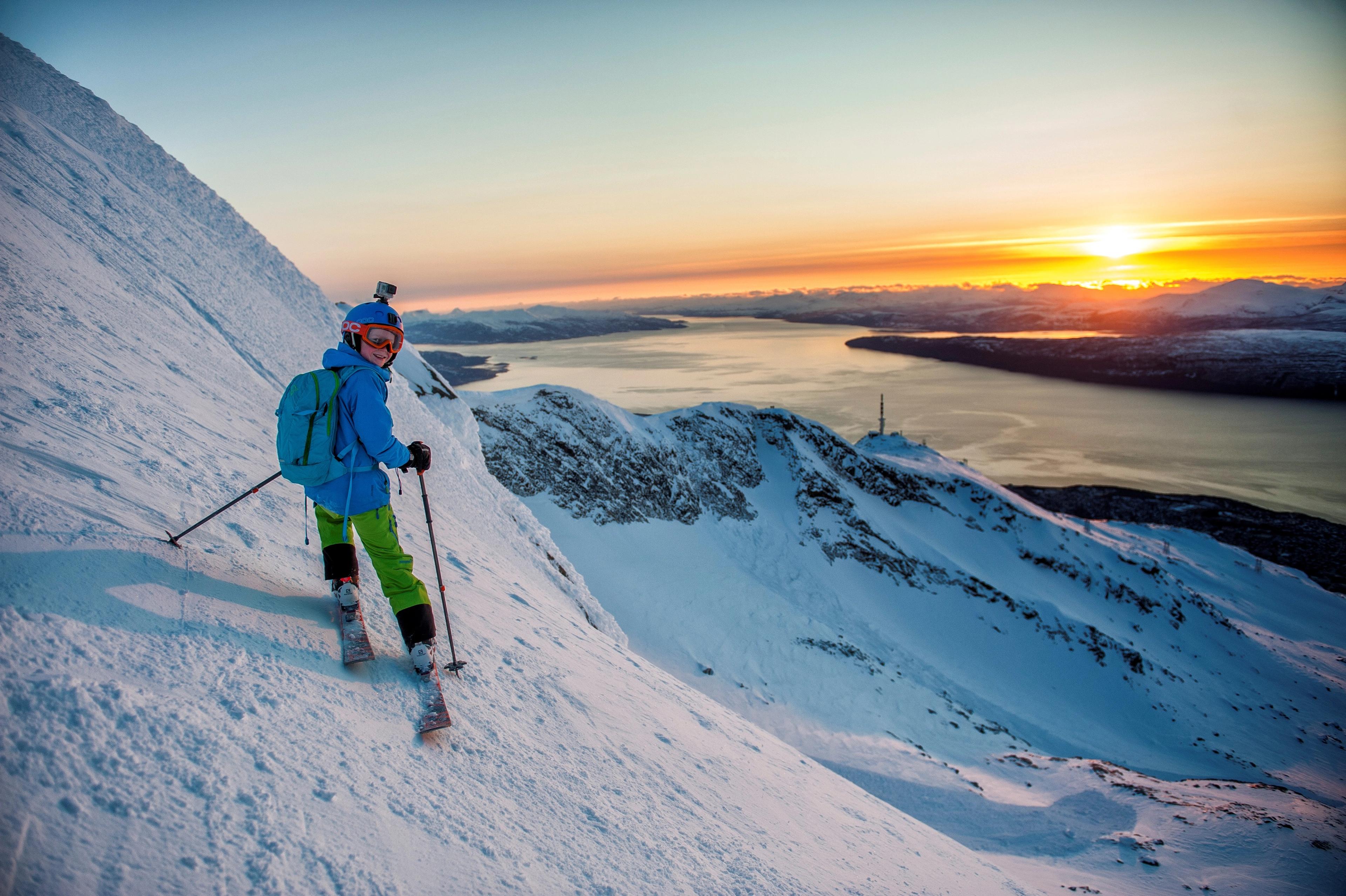 A boy is ski touring during sunset in Narvikfjellet in Northern Norway