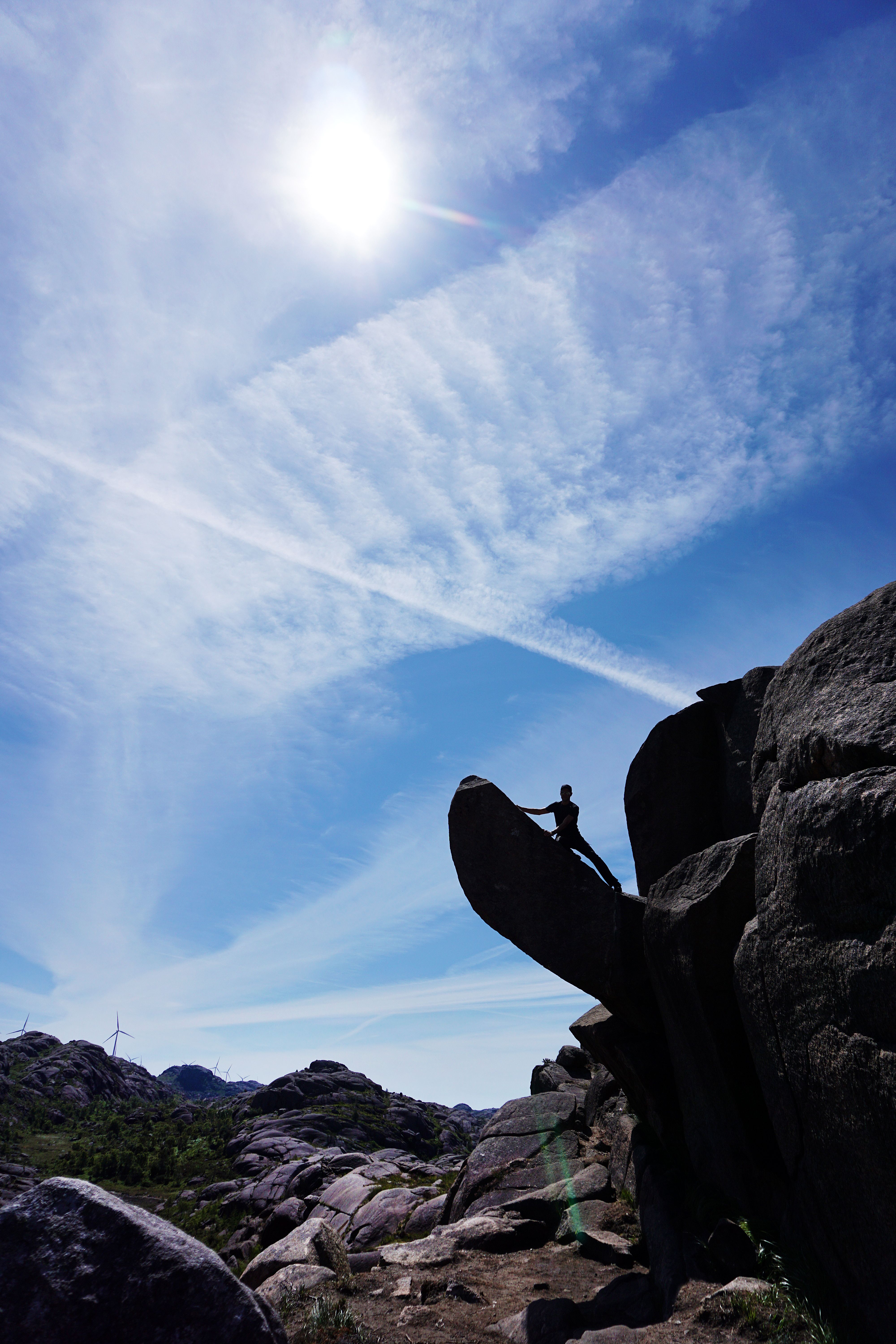 Man climbing the Trollpikken rock in Egersund
