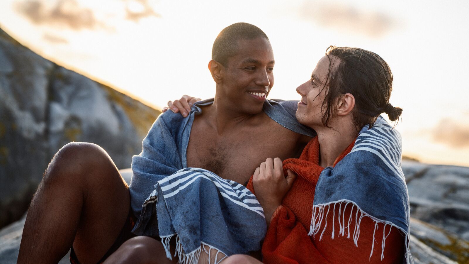 Two men holding around each other in the skerries