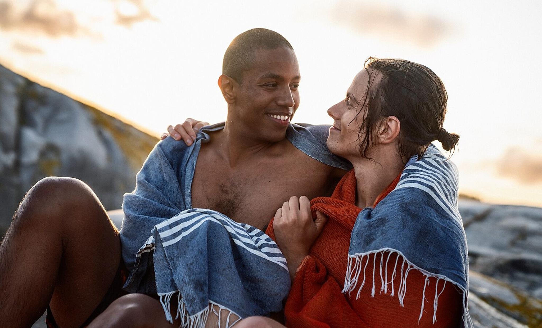Two men holding around each other in the skerries