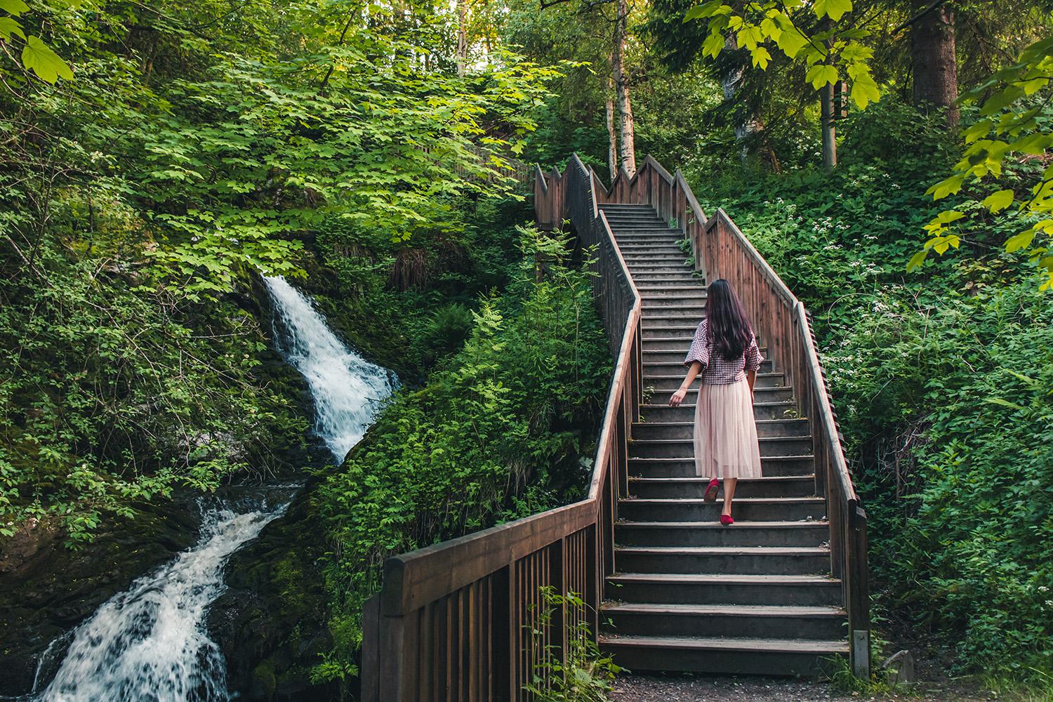 Woman walking stairs of the Iladalen trail, Trondheim, Norway