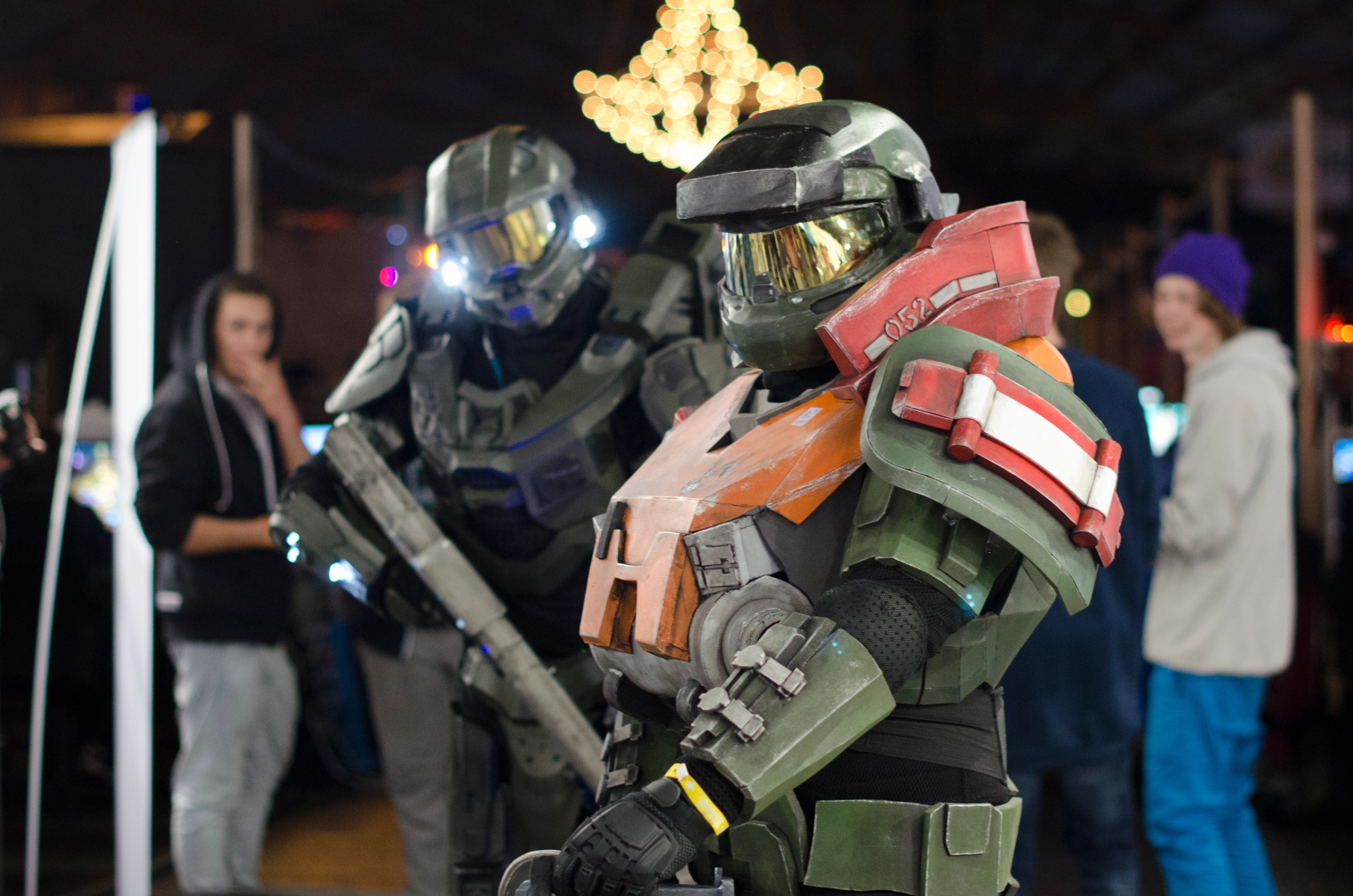 Two cosplayers in Master Chief outfits from the game Halo