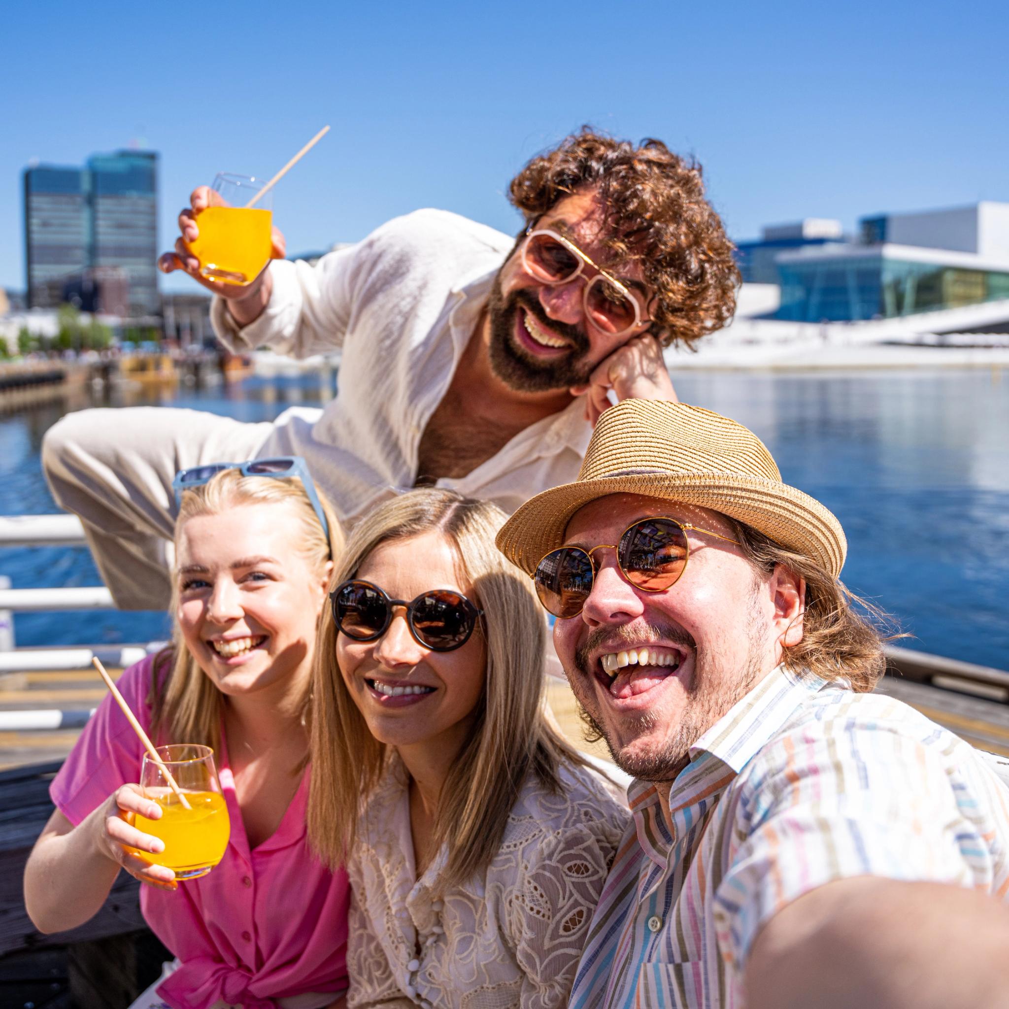 Friend group taking a selfie by Salt in Oslo, Eastern Norway