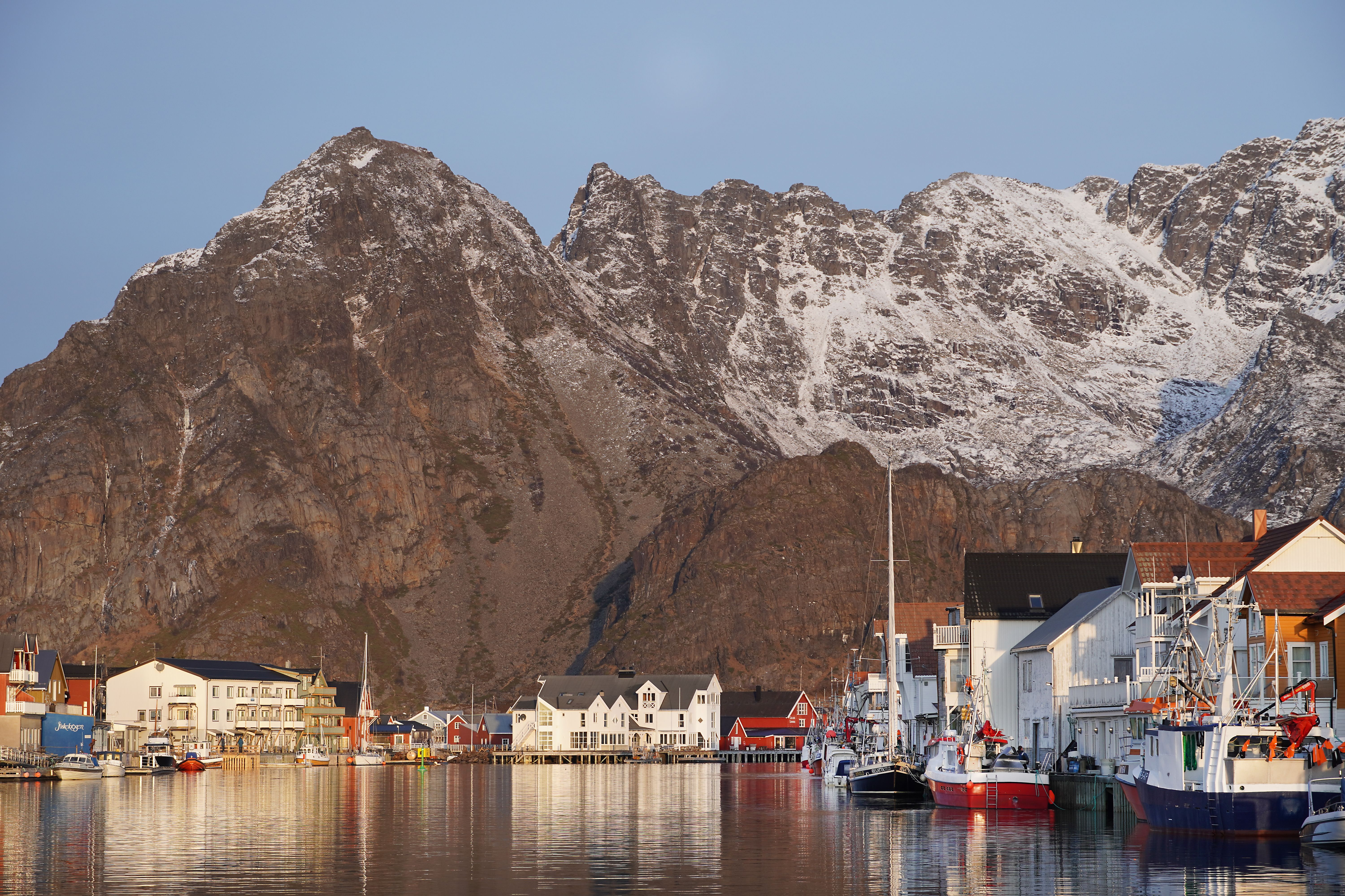 Fishing village at the foot of a big mountain.