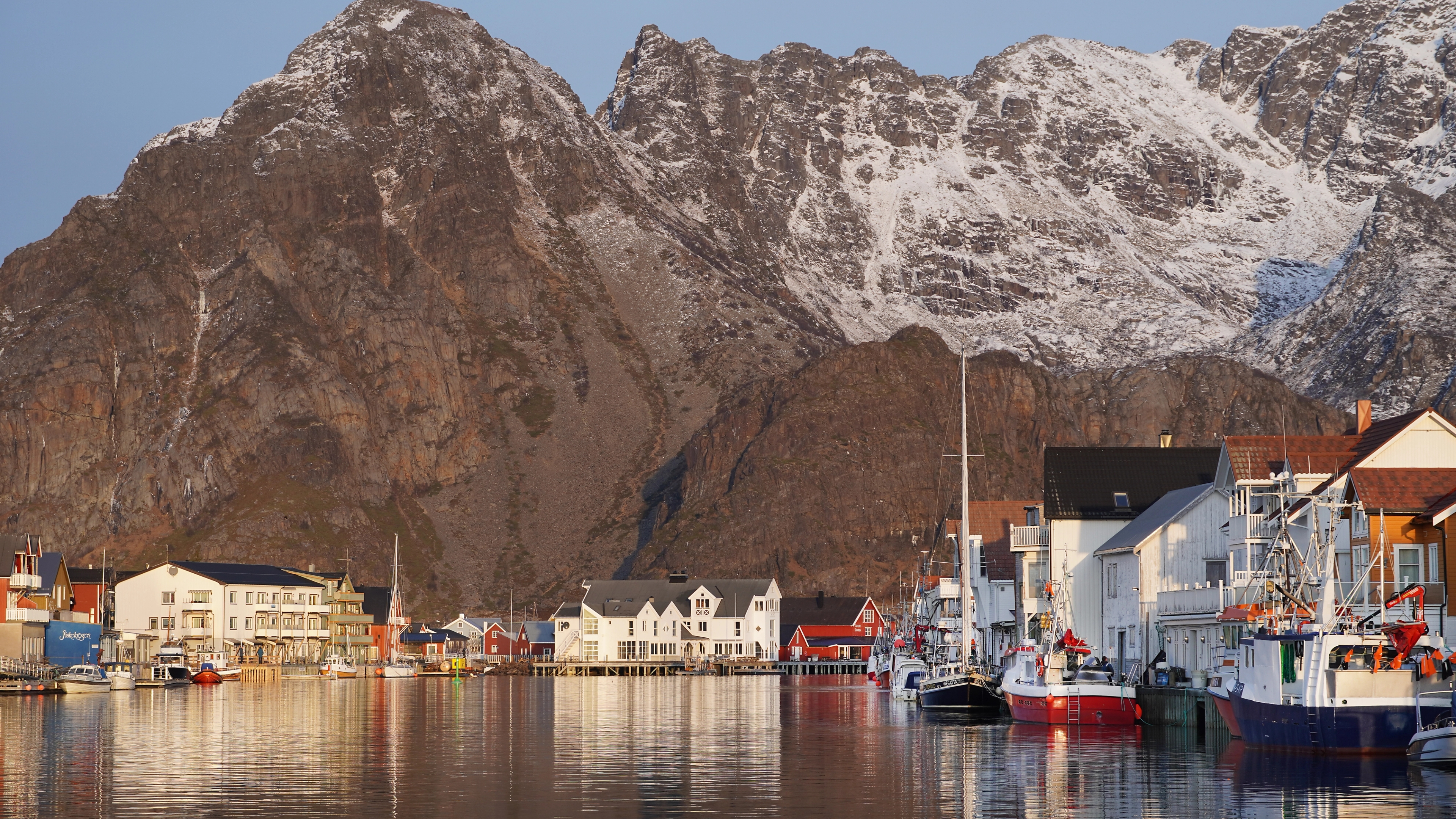 Fishing village at the foot of a big mountain.