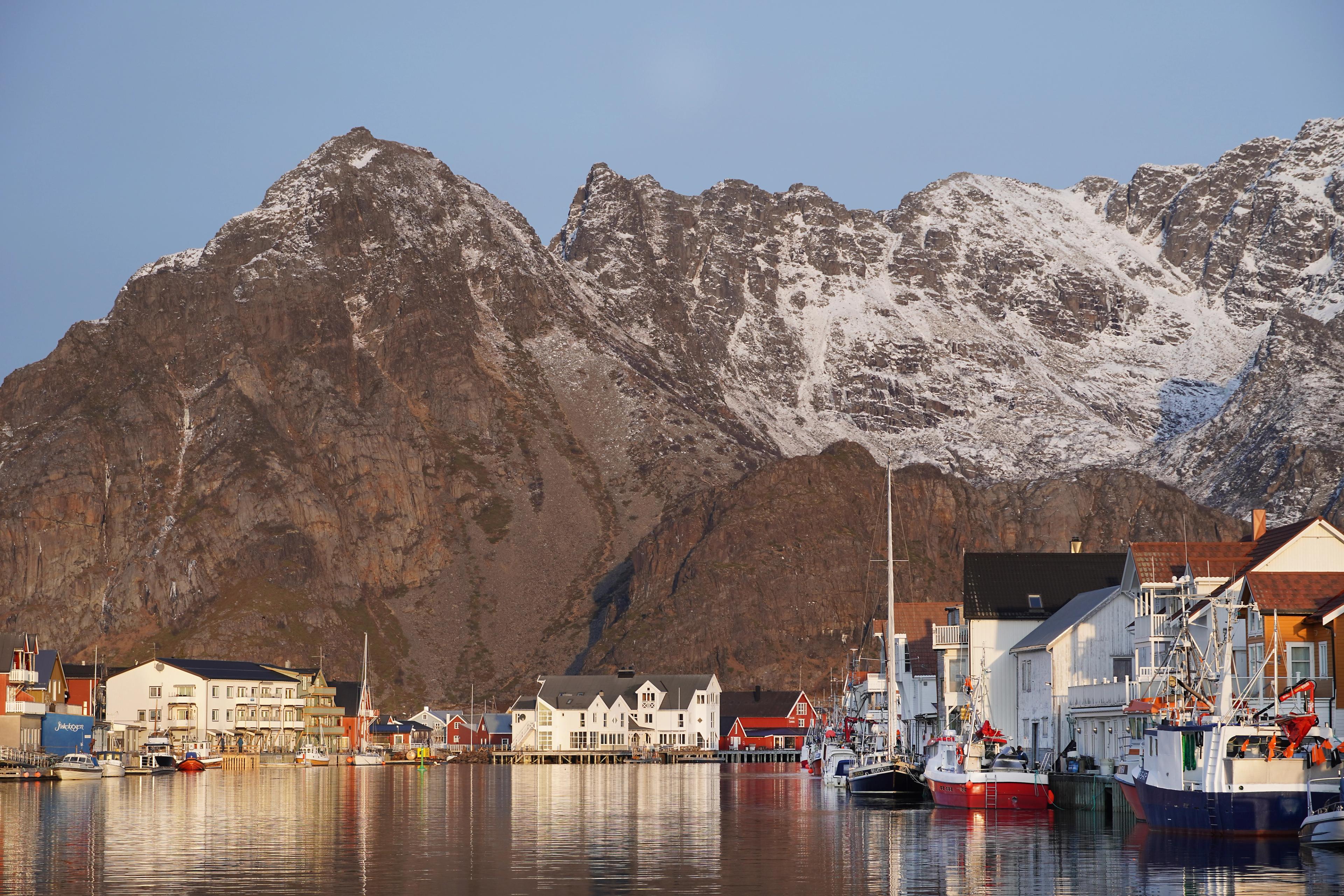 Fishing village at the foot of a big mountain.