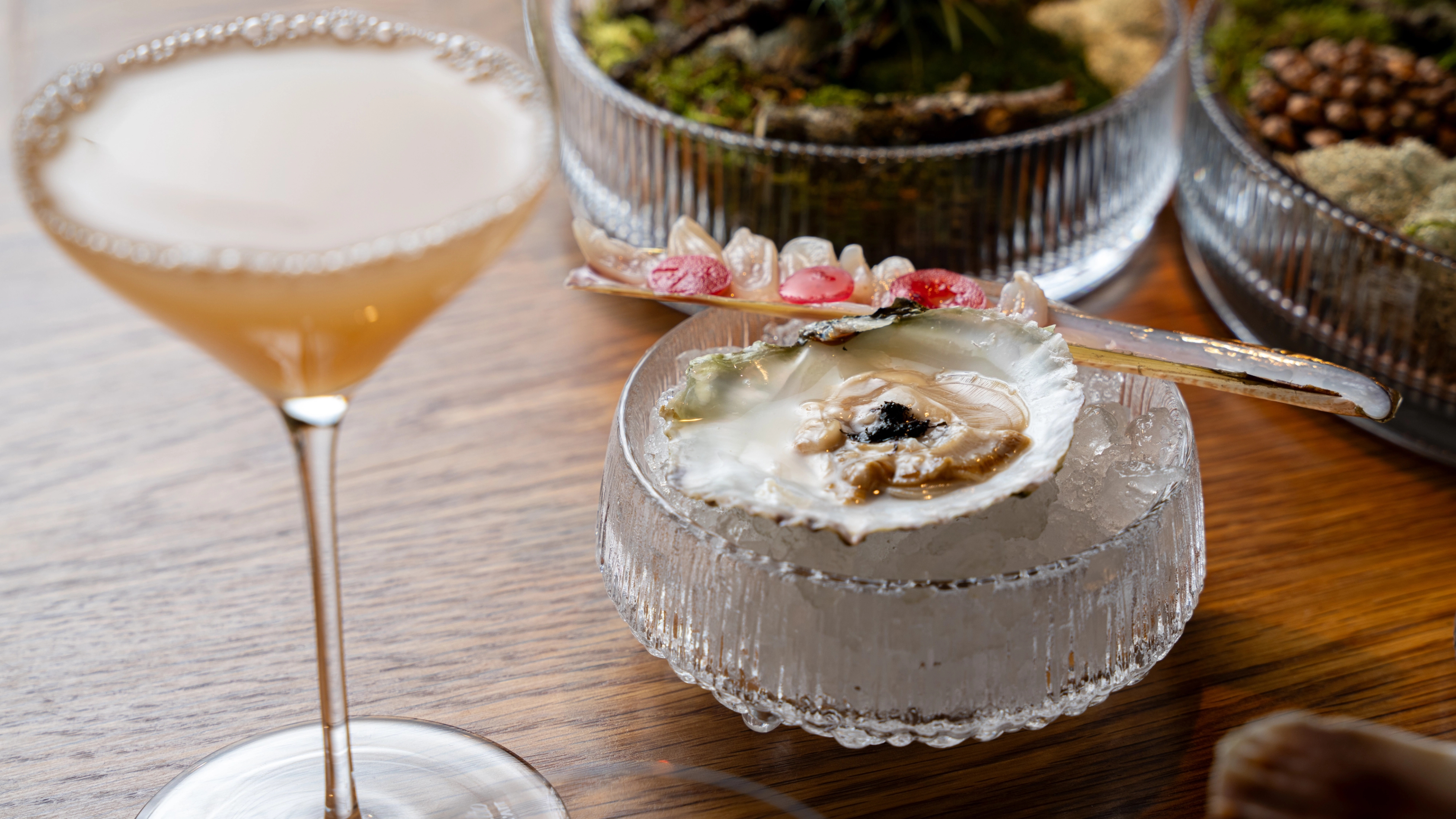 Apple juice, oyster and razor shell served at the Credo restaurant at The National Library in Oslo