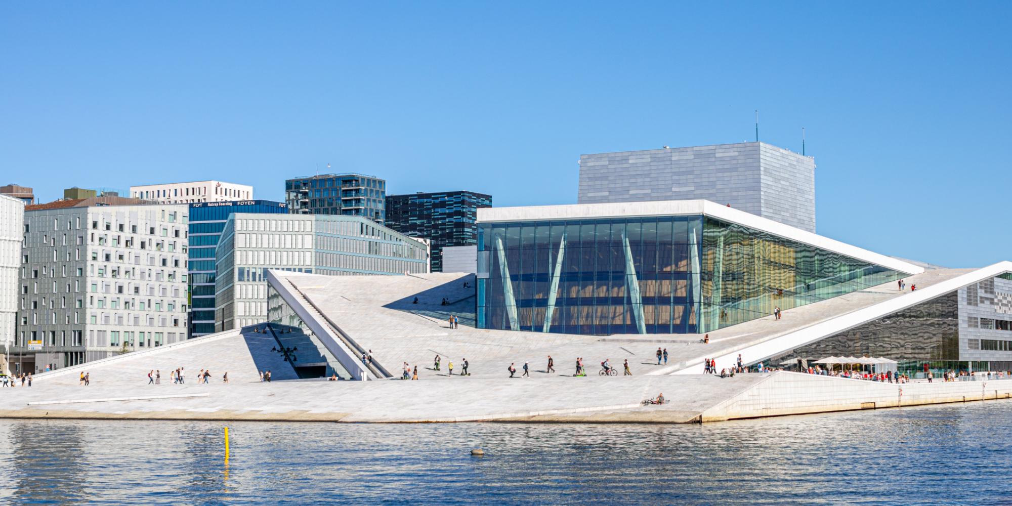 People walking across the roof of The Oslo Opera House