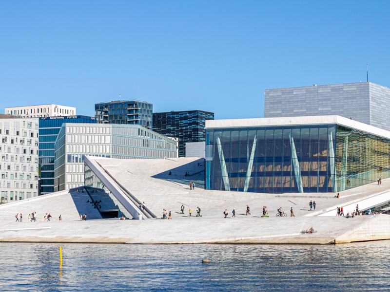 People walking across the roof of The Oslo Opera House