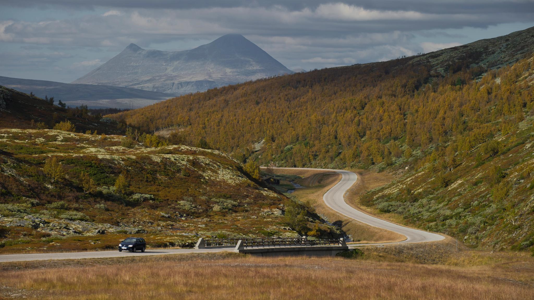 Car driving on a road near the Dovrefjell mountains, Eastern Norway