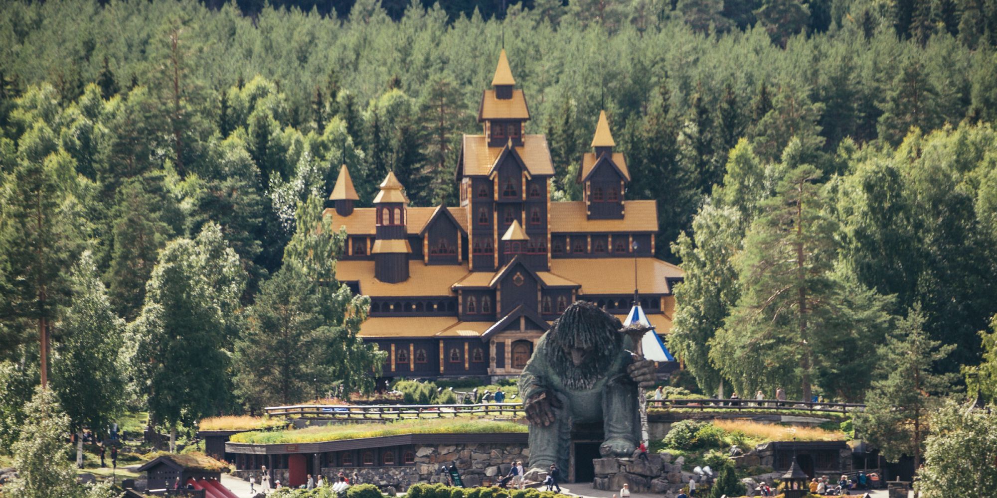 A view of Hunderfossen fairytale park with the Hunderfossen troll in front of the Farytale castle