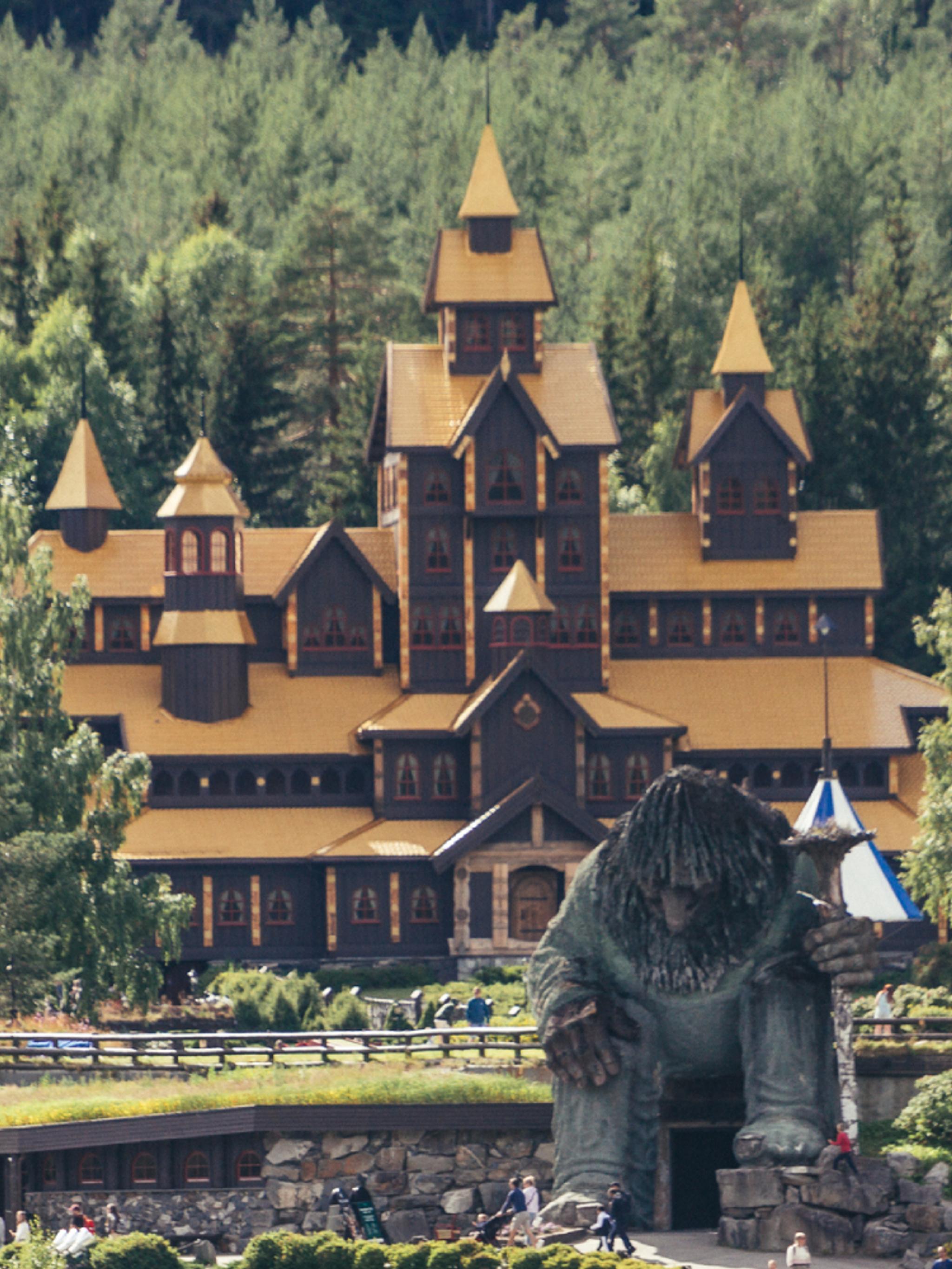 A view of Hunderfossen fairytale park with the Hunderfossen troll in front of the Farytale castle